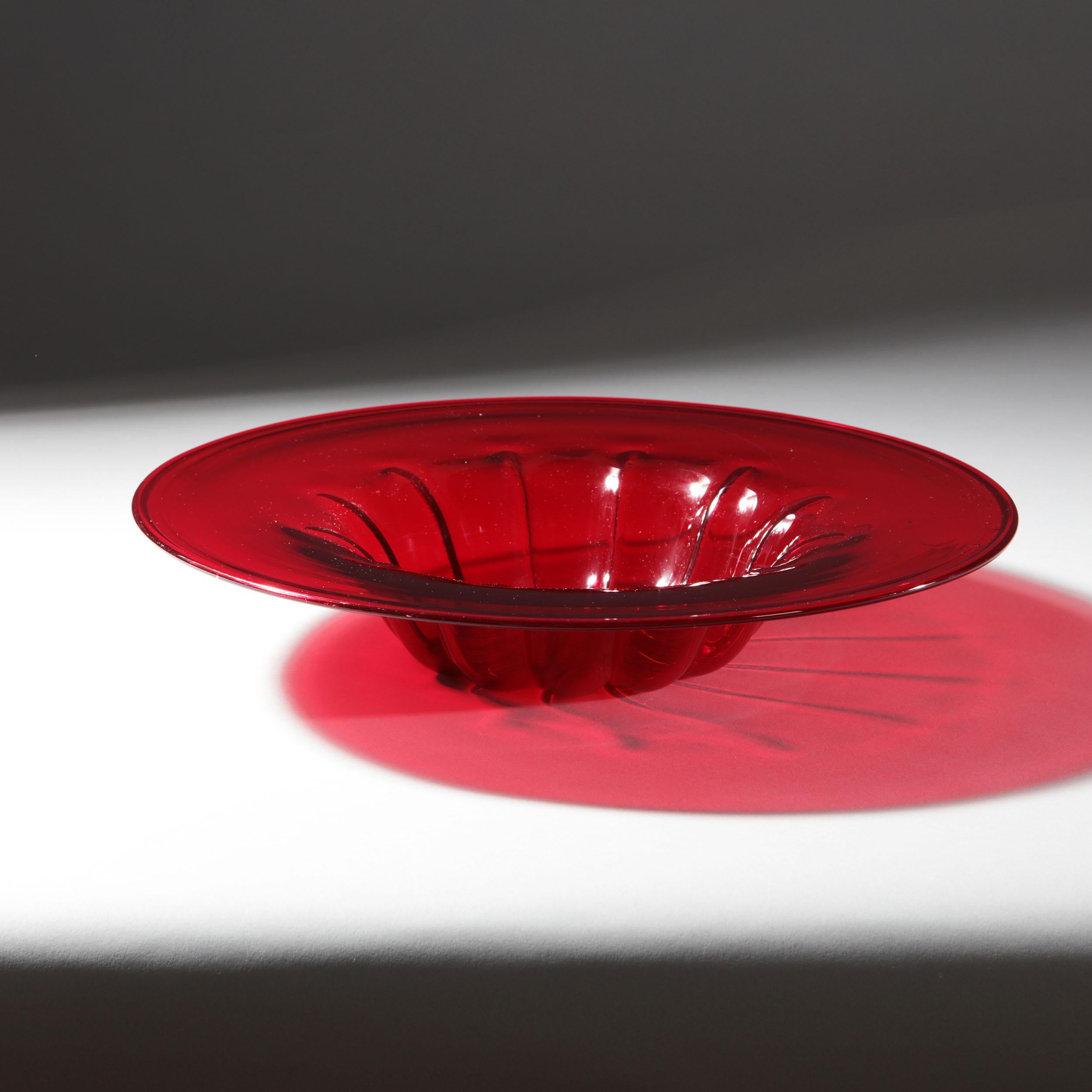 1950s Vibrant red molded Murano glass dish by the famous and most prestigious glass house Pauly & C.

This fine hand blown dish is modeled on a red Cardinals hat. The shaped bowl with ribbed sides and a slightly inverted base, the bowl outer rim
