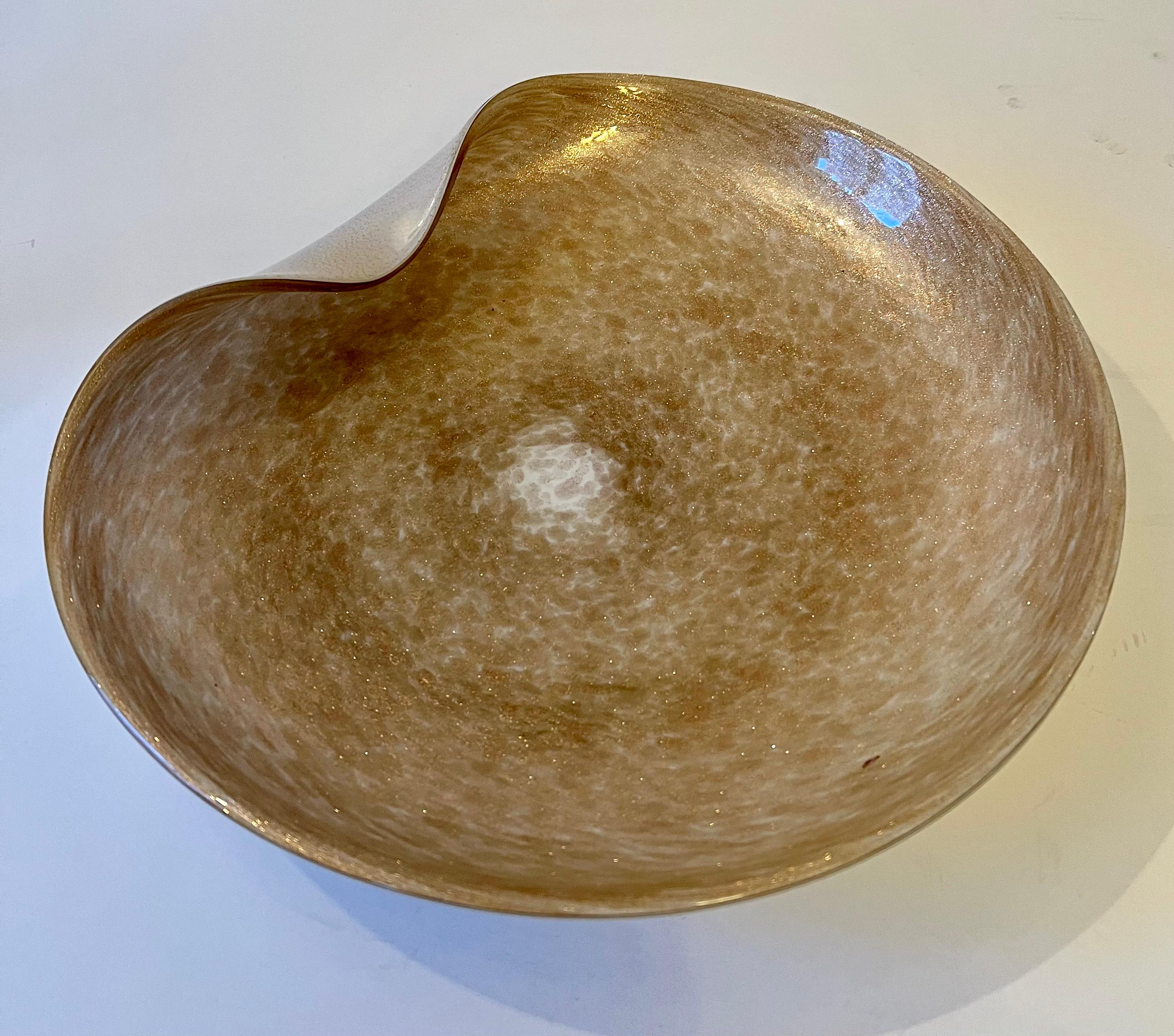 A lovely Glass Murano bowl or platter - a compliment to any cocktail table as a functional piece or decorative item. A curve of opaque white glass wraps up to the top, with gold flecks in the glass this piece is an impressive conversation starter.