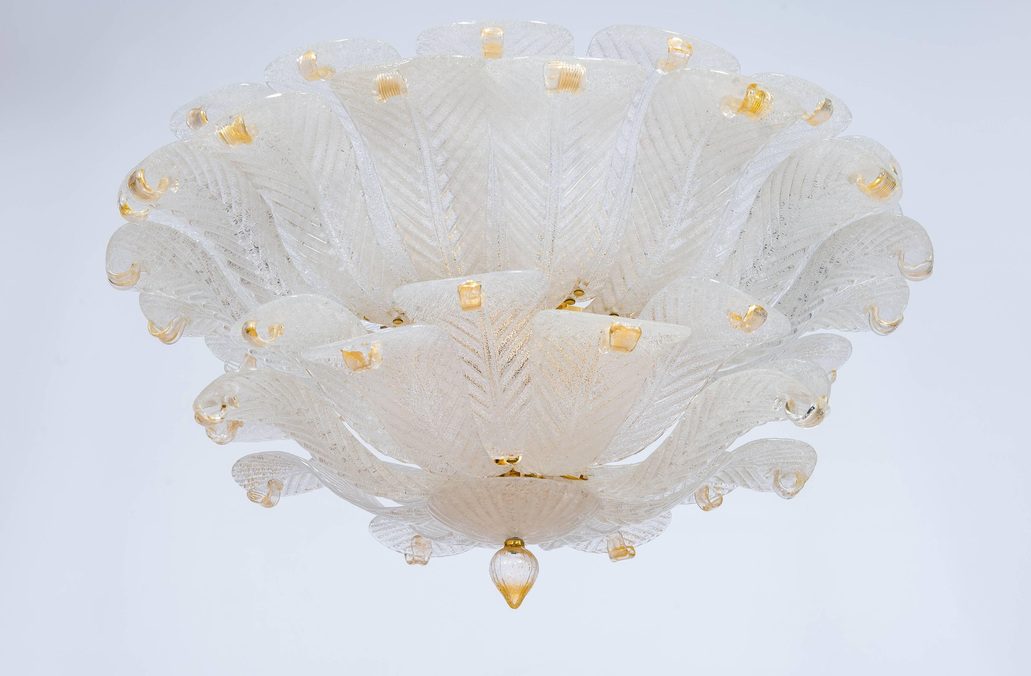 Italian Flush Mount in Murano Glass Milk color leaves and Gold fineshes, 1990s
This fantastic flush mount is constituted by a set of leaves disposed in different layers, with a unique design. Along the flush mount are inserted nine bright lights and