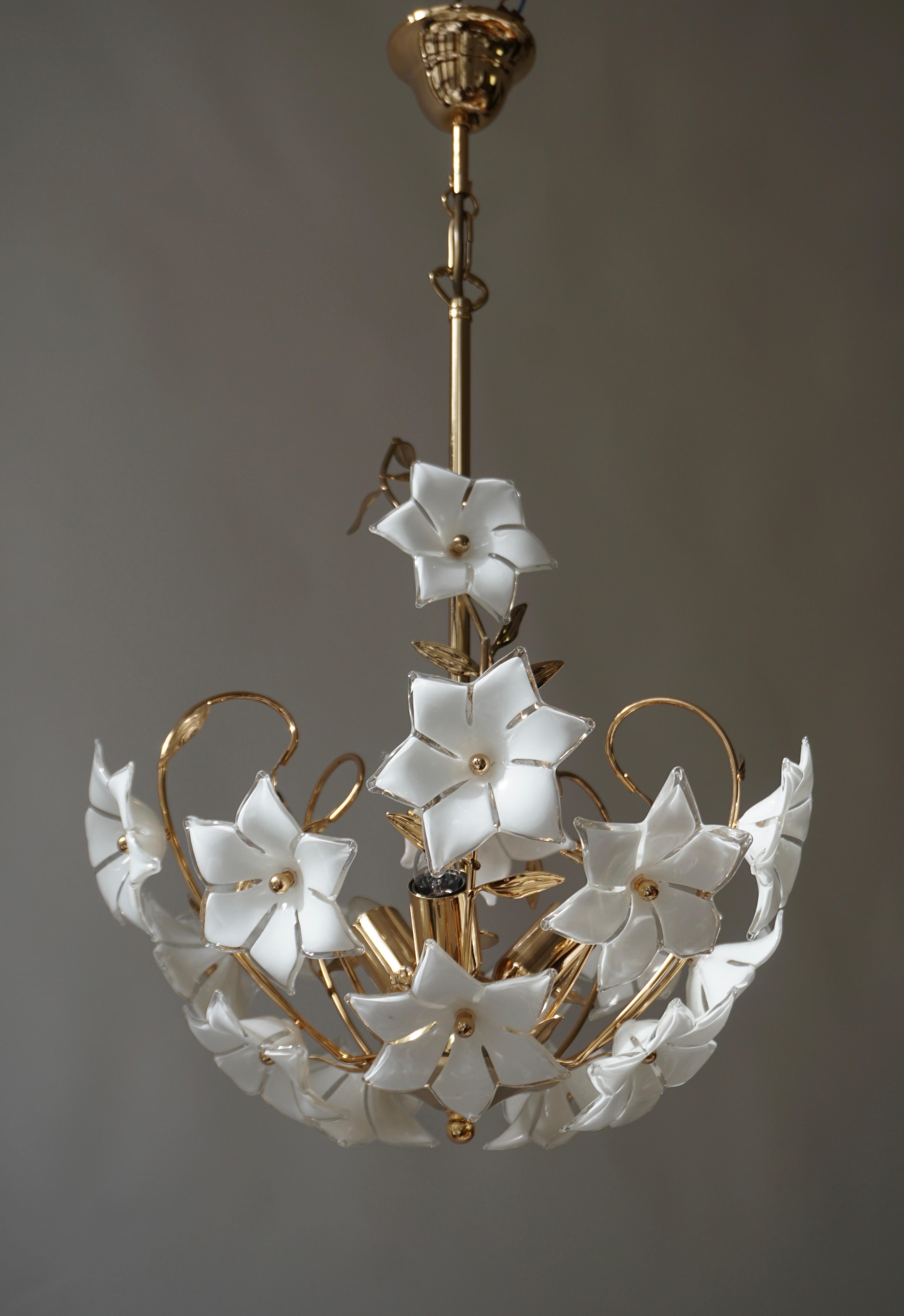 Italian Murano glass white flower chandelier. 

This stunning piece has such a light, delicate white color and brings such a warmth to any space.
The current height from the ceiling is 26