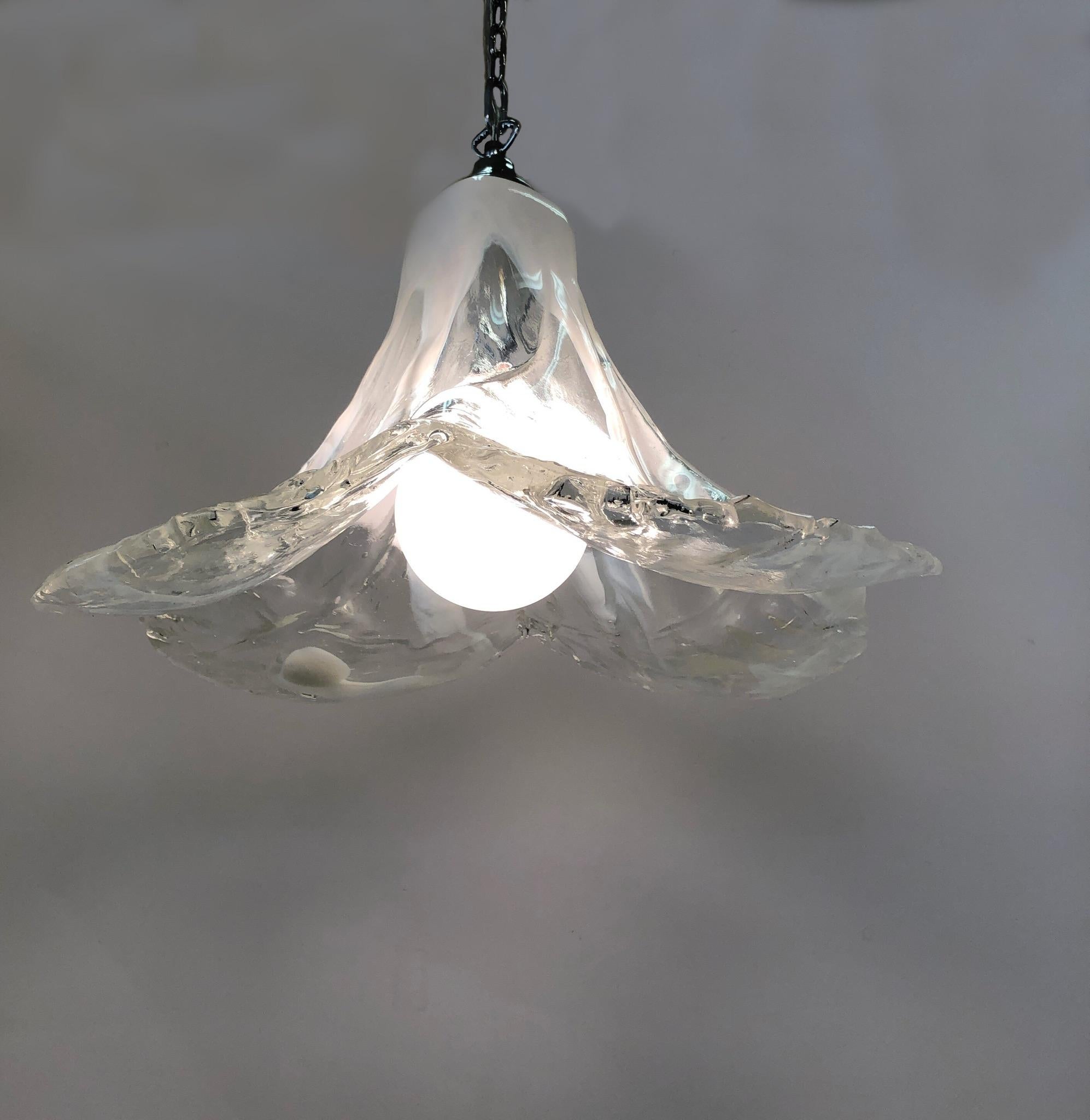 A spectacular had blown Italian Murano glass “Petalo” chandelier design by Carlo Nason for Mazzega in the 1960’s. This is an early “Petalo” chandelier, all one piece of hand blown clear and white Murano glass. The chandelier has been newly