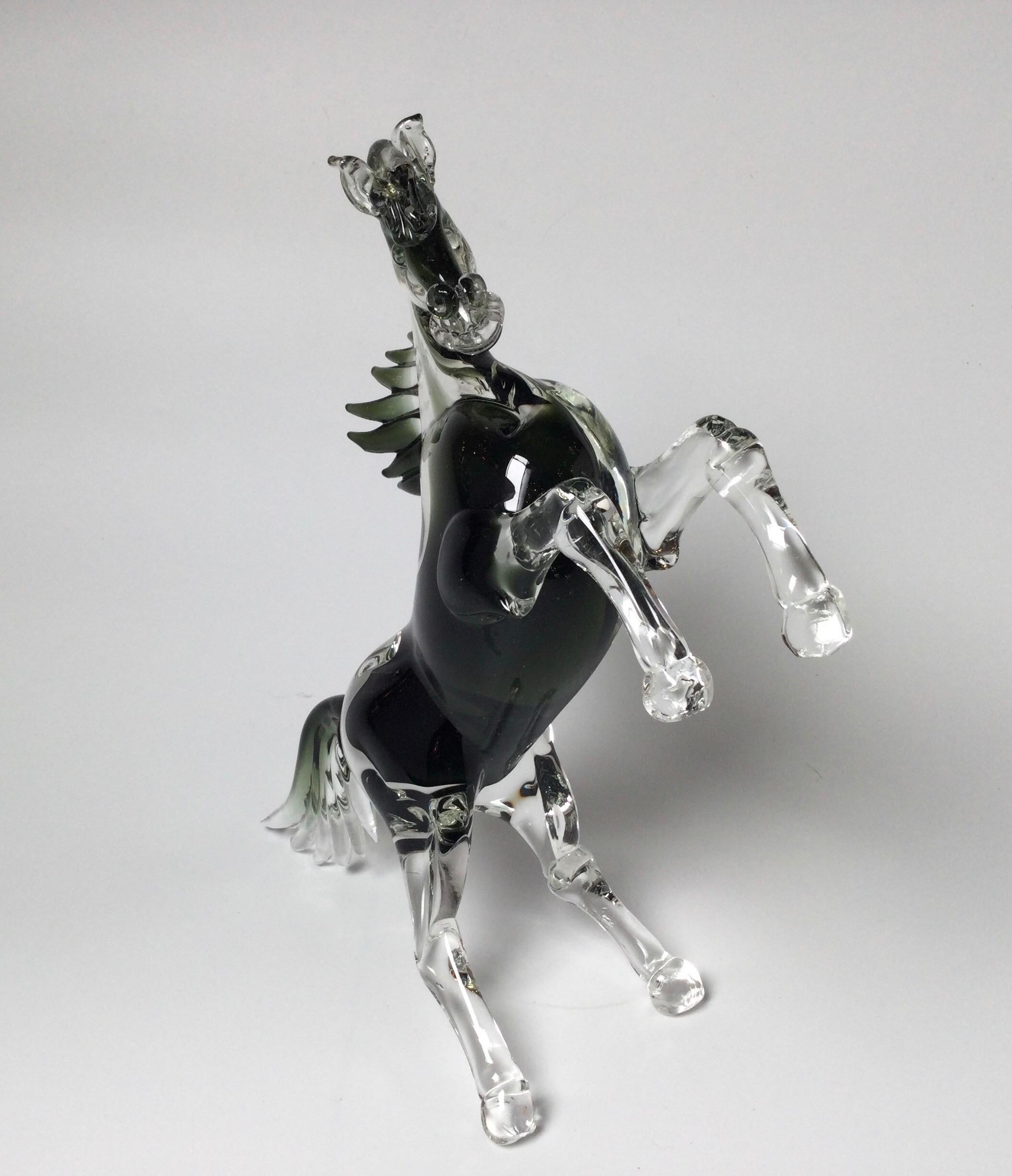 Hand made Murano glass horse sculpture with clear and smoky topaz color. The horse in a upright position with flowing mane and tale.