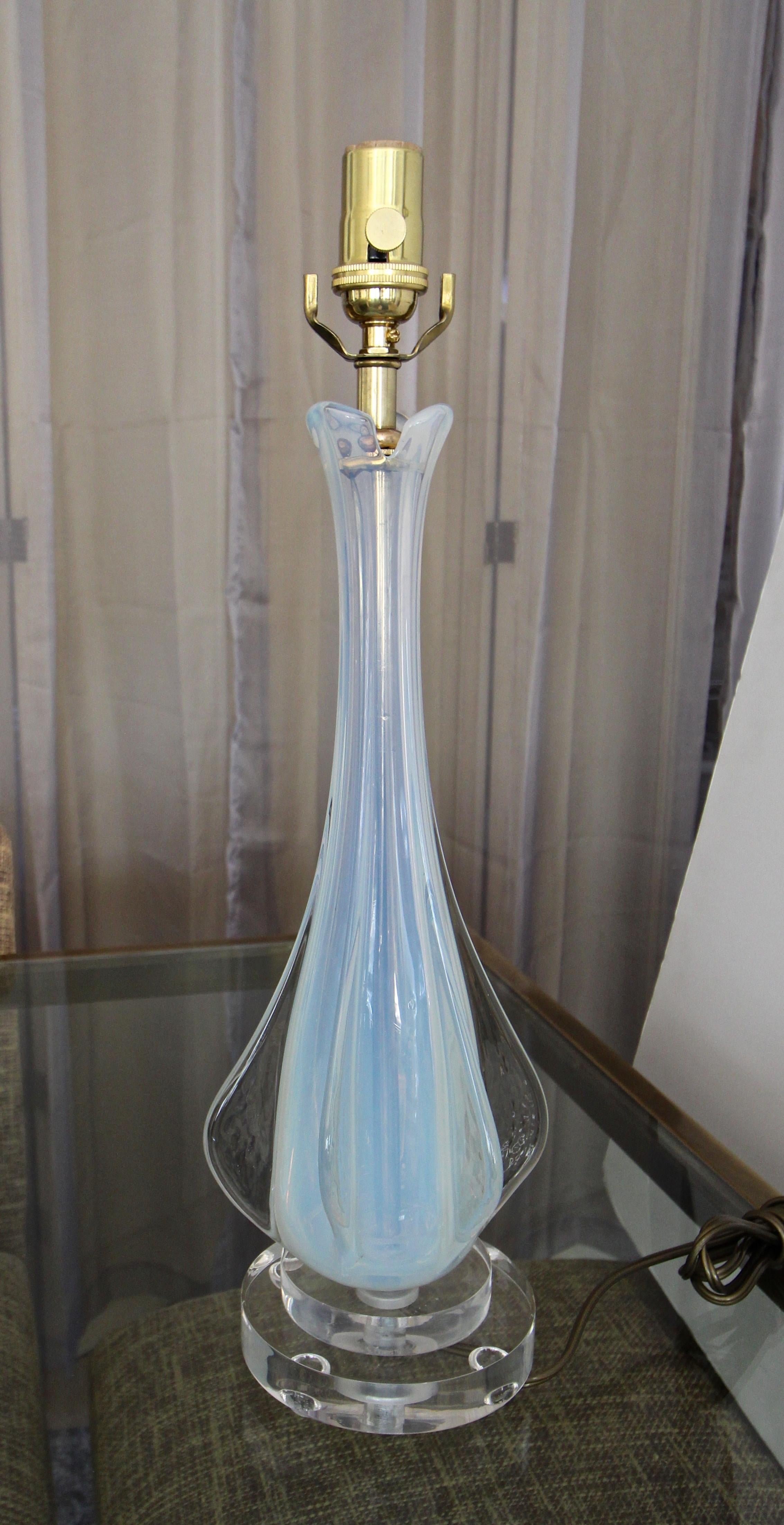 A smaller scale Italian Murano glass table lamp in opalescent glass encased in thick clear glass with protruding fins. Glass sits on top of custom acrylic base and is newly wired for US with new brass socket and cord. Shade not included and is for