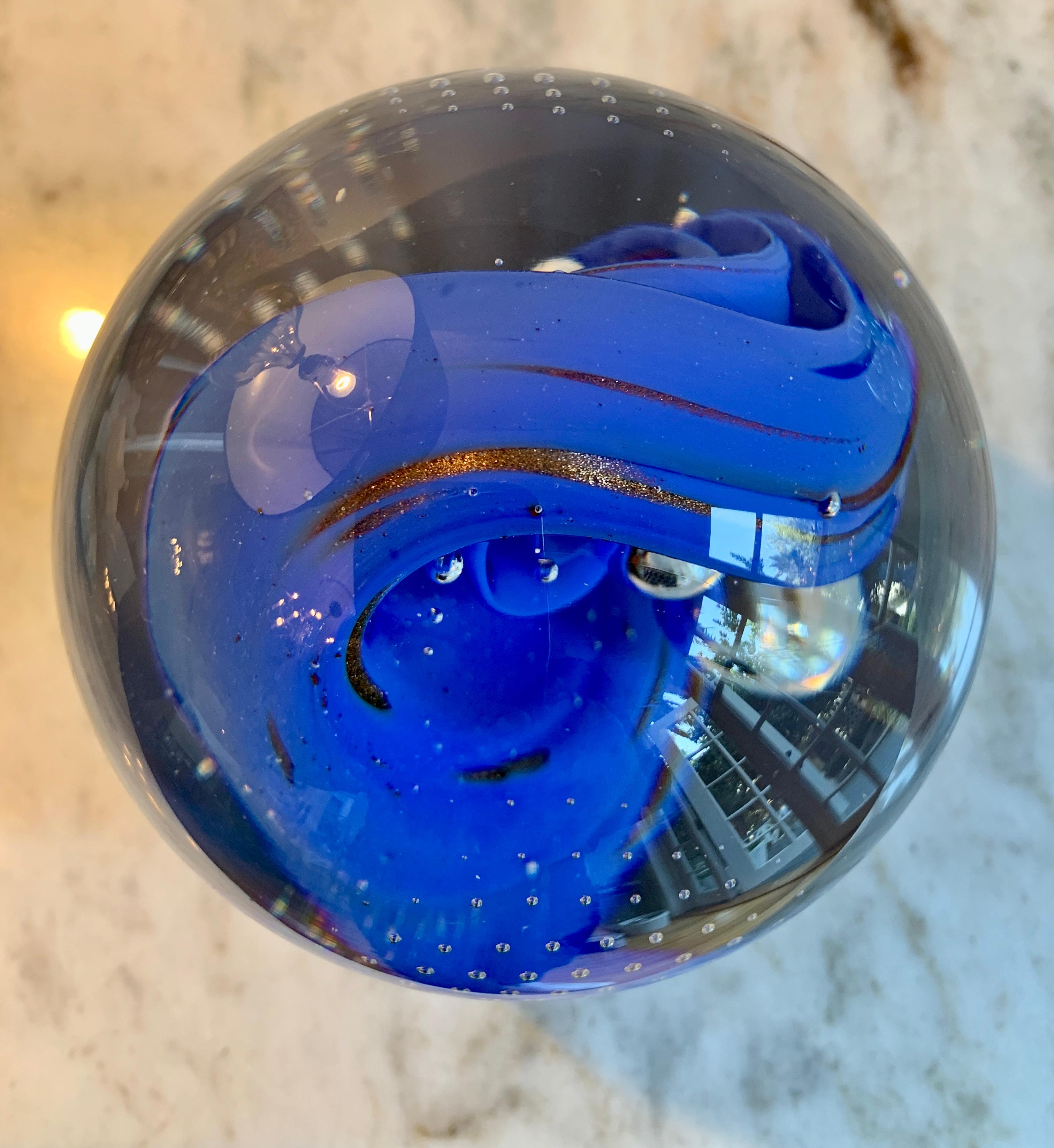A wonderful desk paper weight with blue accent color of Italian blue Murano glass.