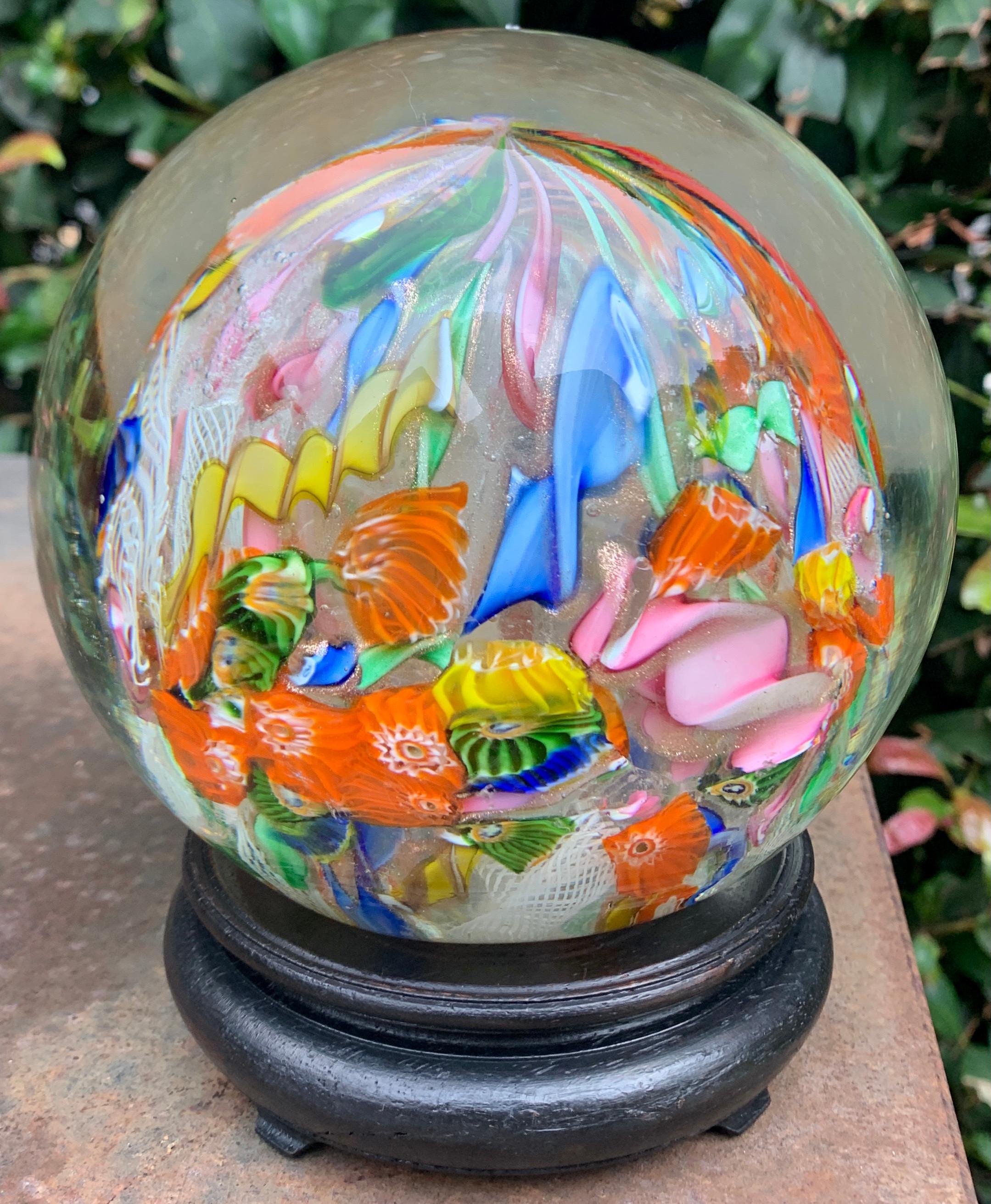 A very large Italian Murano Paperweight. A spectacular example of hand blown work combining, not only many colors, but a large array of ribbons, spirals, etc. Added to the color and size is the addition of gold, which makes this a wonderful
