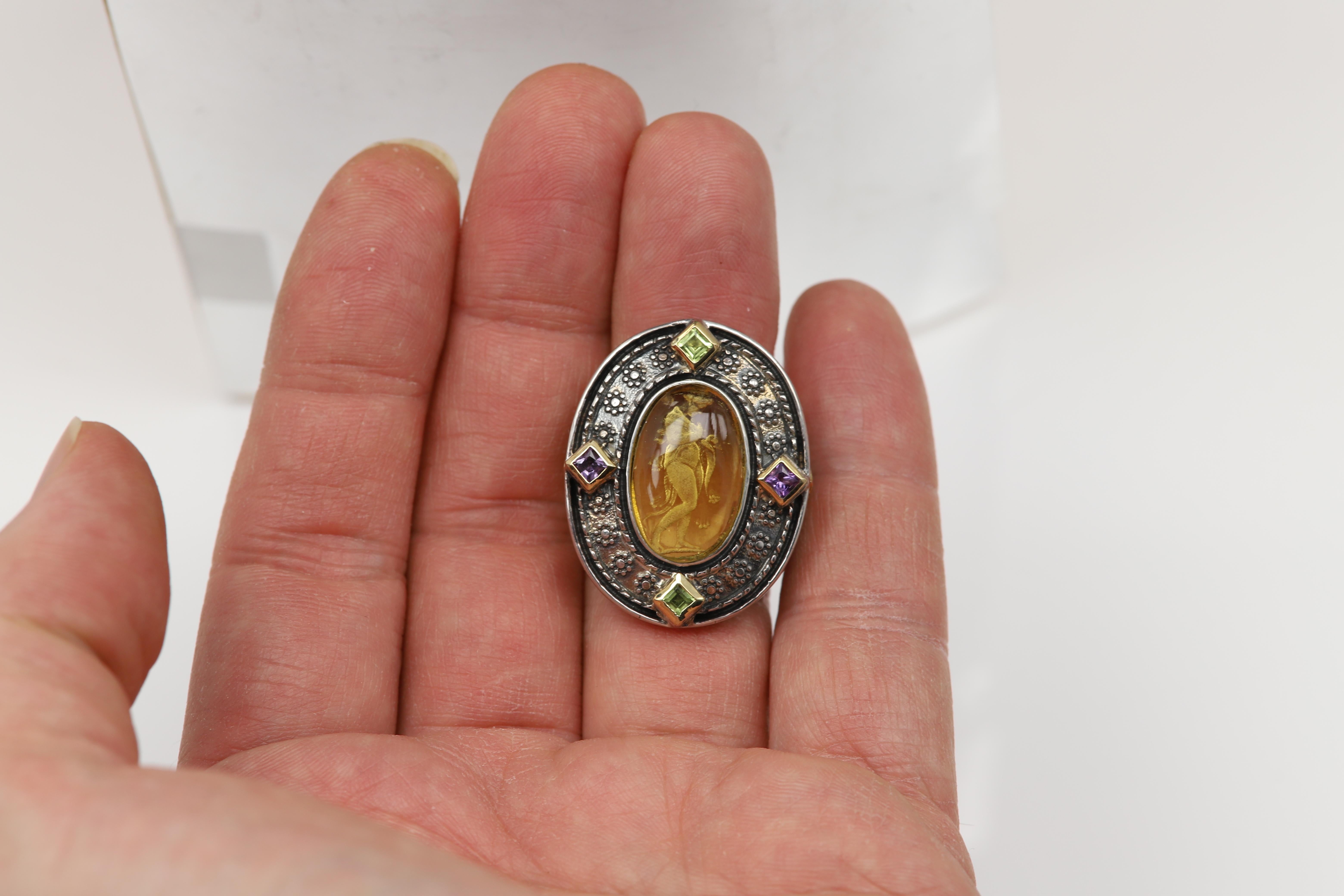 Venetian Yellow Murano Glass Antique / Gothic Style Ring
Engraved Image of 
Omphale, queen of the kingdom of Lydia in Asia Minor.  In her best known myth she is the master of the hero Heracles during a year of required servitude.
Sterling Silver