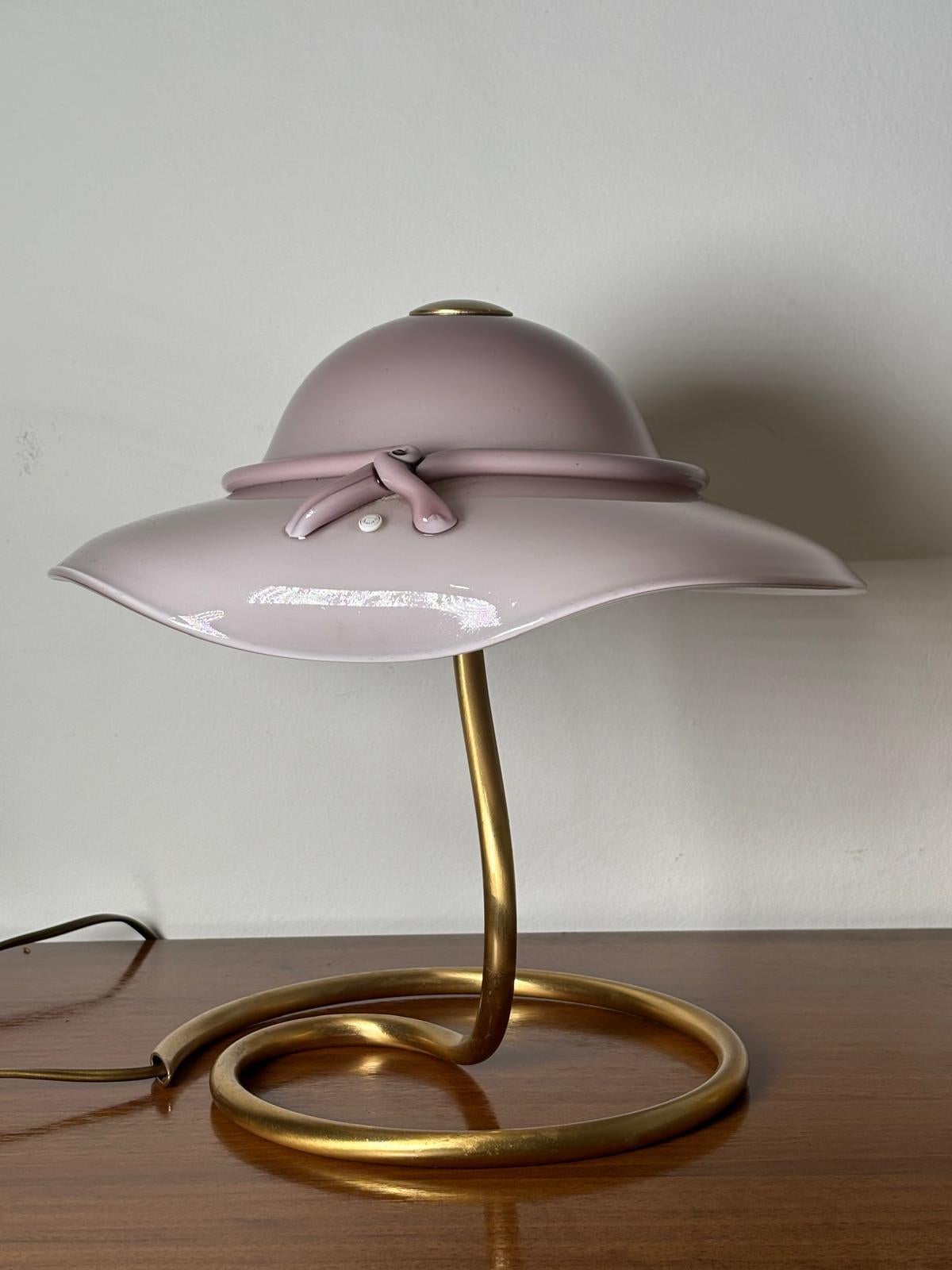 Italian Murano glass table lamp designed and produced by La Murrina in 1980. The structure of the lamp is in brushed brass.
Perfect conditions. Signed.

Short story:
The story of the company dates back to the 1960s in Murano where there was a small