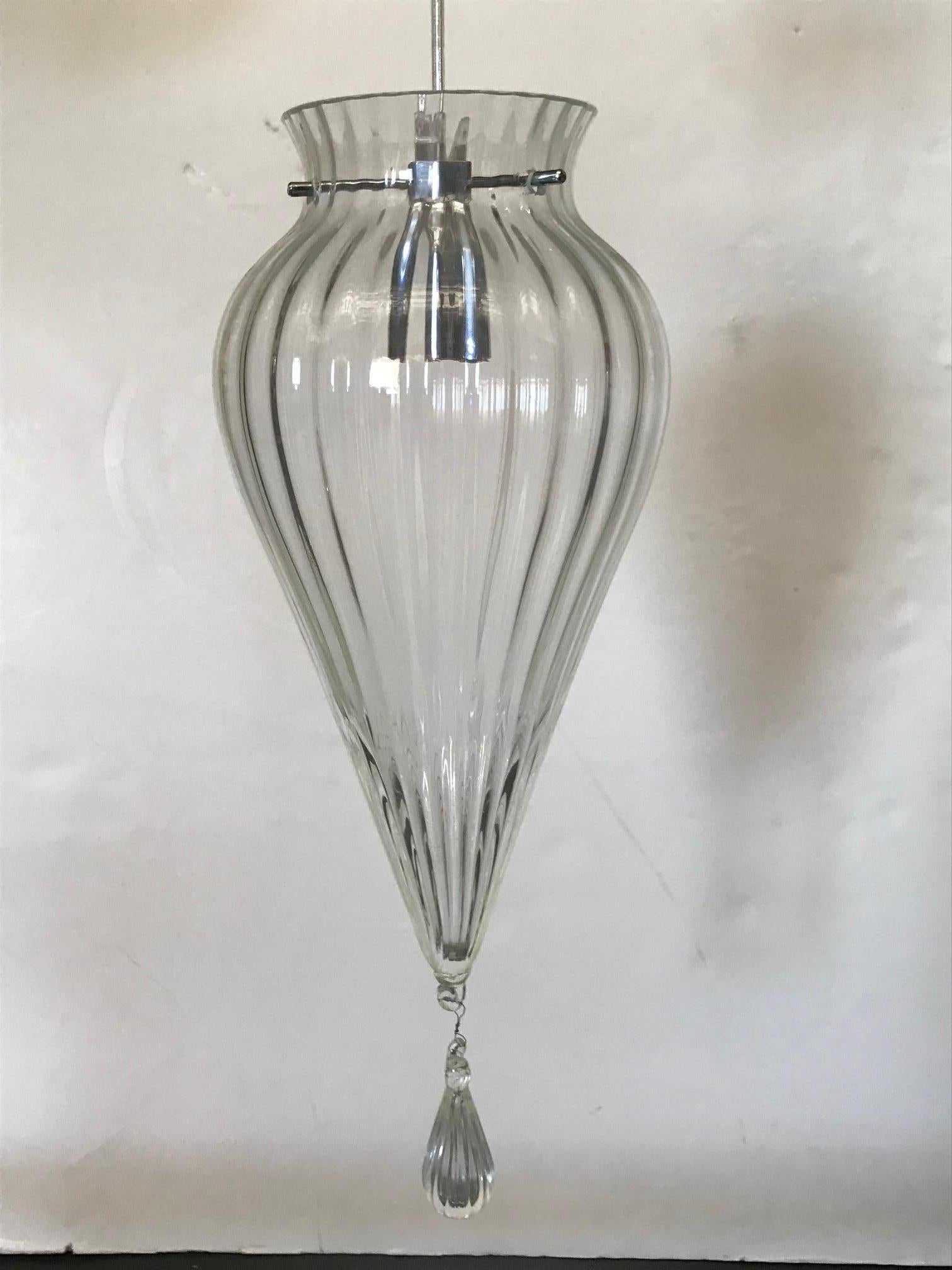 Vintage Italian teardrop pendant with hand blown clear Murano glass, mounted on chrome hardware / Made in Italy circa 1960’s
1 light / G9 type / max 60W 
Height: 18 inches plus chain and canopy / Diameter: 7.5 inches 
1 in stock in Palm Springs