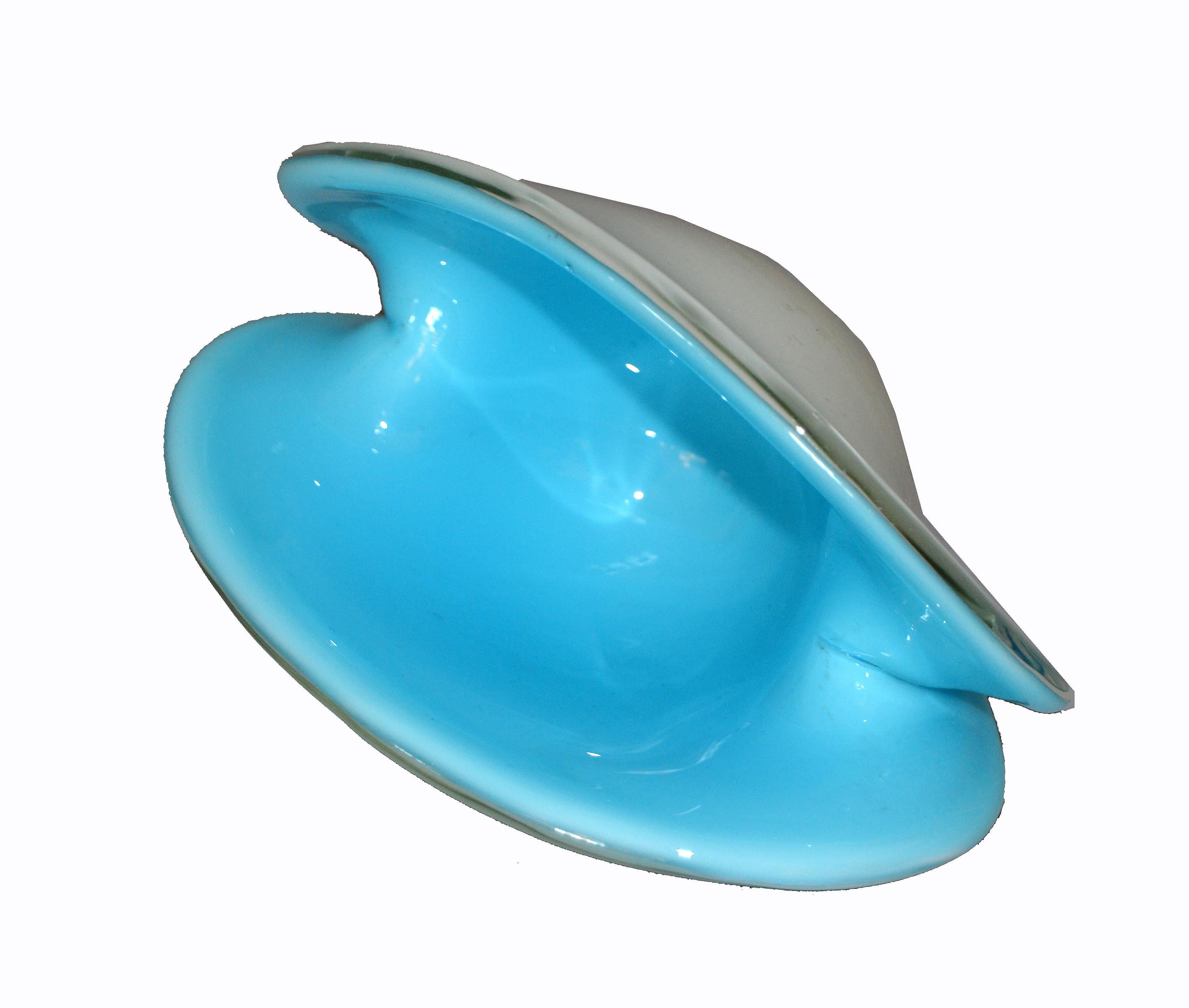 Italian Murano glass two-color triangular shaped catchall bowl. Turquoise blue interior that takes on an organic look, white outer casing.
Simply beautiful.