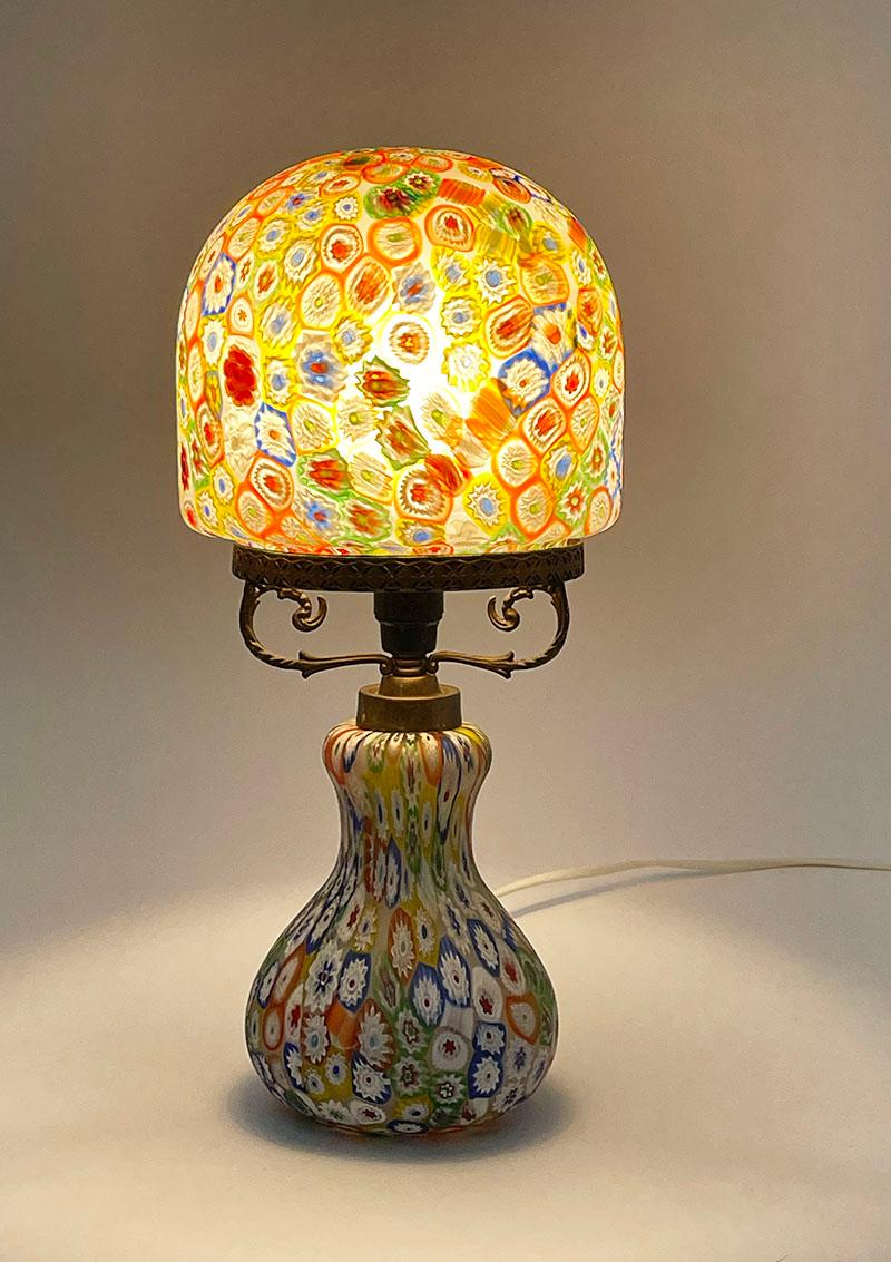 Italian Murano handblown glass Millefiori table lamp, 1960s

A mushroom shaped table lamp by Murano. A handblown glass lamp base with a handblown glass shade with the pattern of Millefiori, the thousands of flowers is well known Italian Murano glass
