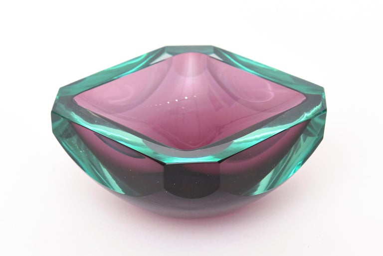 This vintage Italian Murano glass faceted square bowl has jewel tone colors of luscious emerald green and the purple center. The sides are semi faceted paddled and the 4 corners are an angled. Great as is as a beautiful Italian Murano glass object
