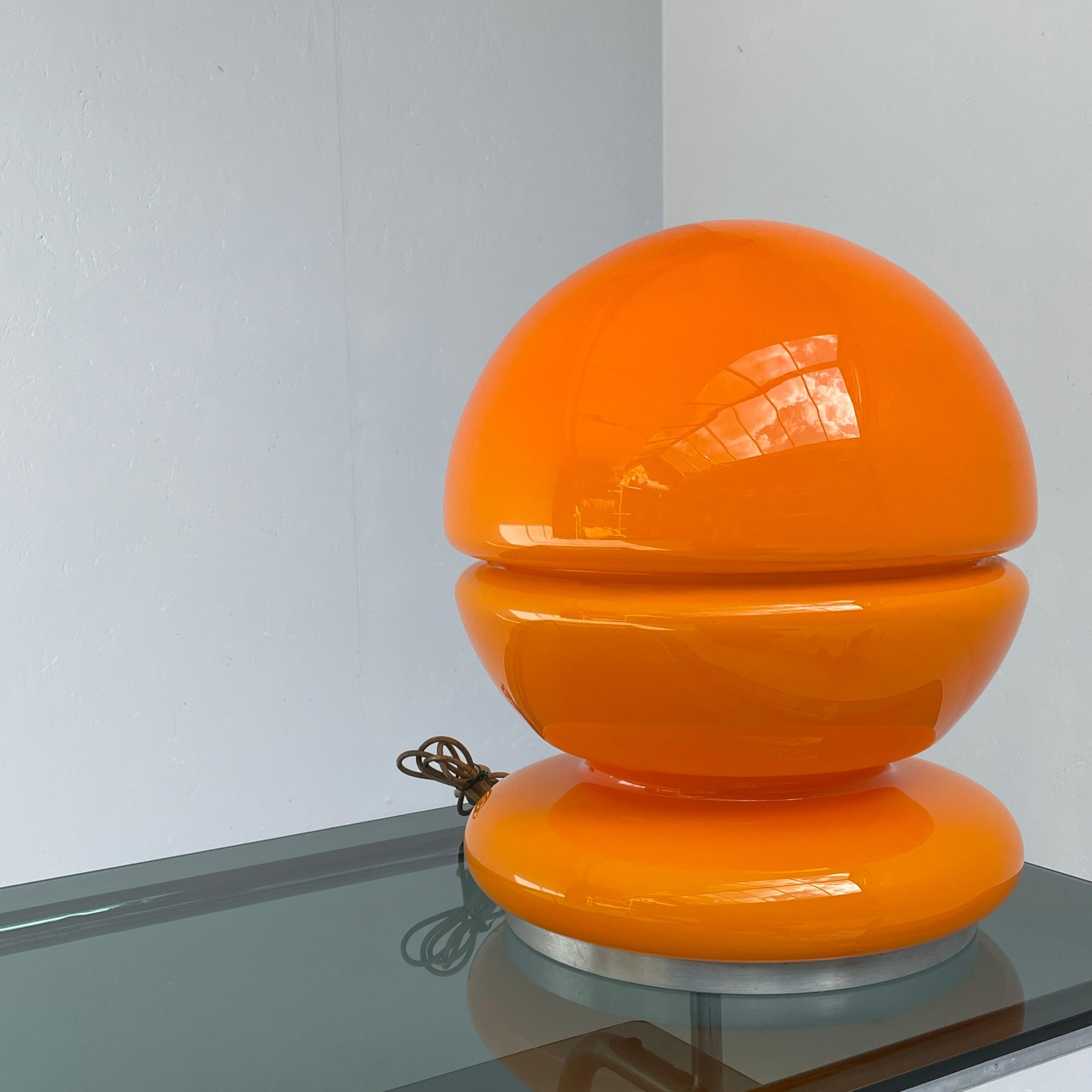Space age floor or table lamp. In the style of Carlo Nason for Mazzega. Italian production from the 60' - 70s. This lamp has the perfect size to be placed on the floor or table and provide a very cozy and diffused ambient lighting. Orange blown