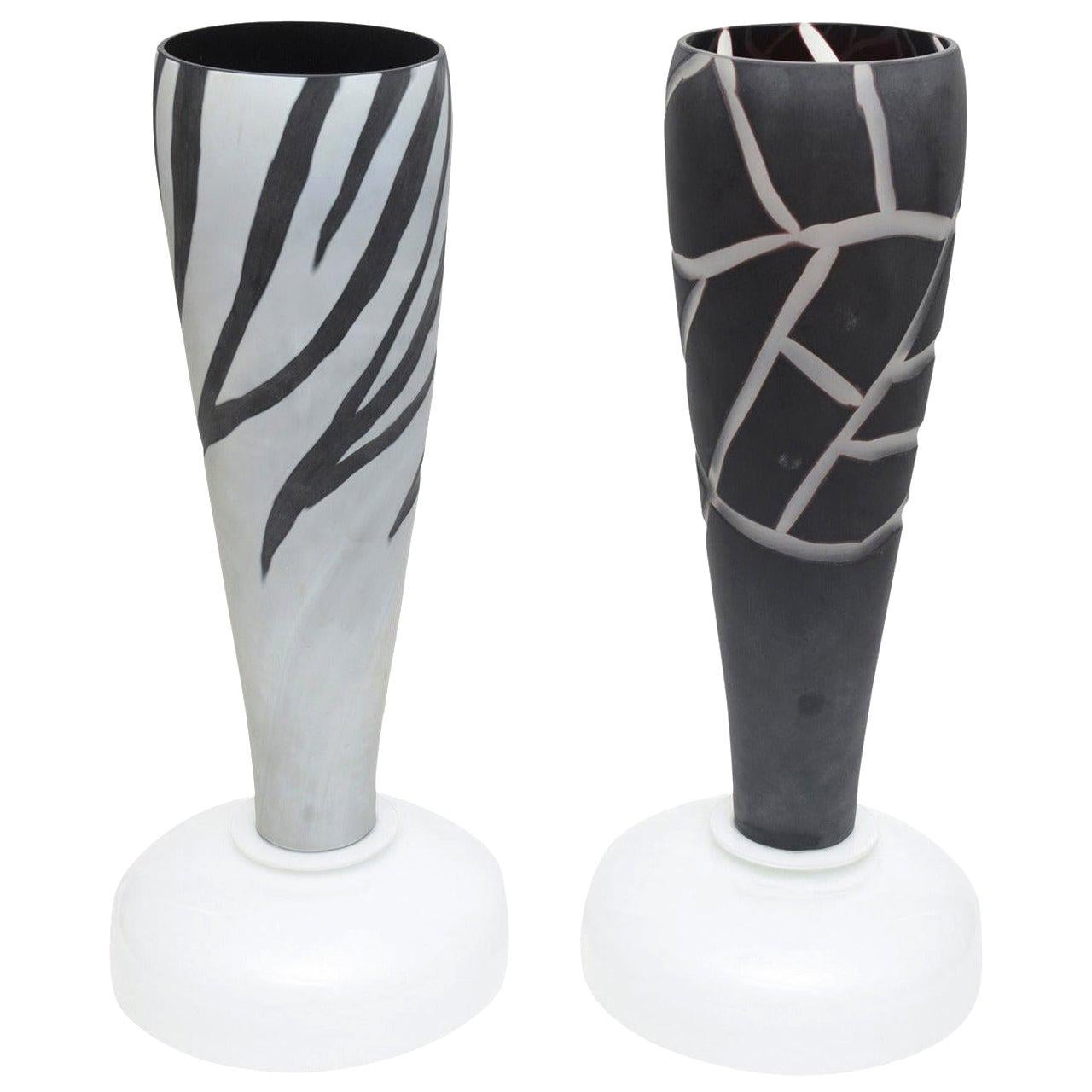 These wonderful pair of Italian Murano intaglio etched Mazzega unusual table lamps are for high drama and beauty. Gray on black and black on gray... frosted glass. The reverse design on each lamp makes quite the statement on either side of a