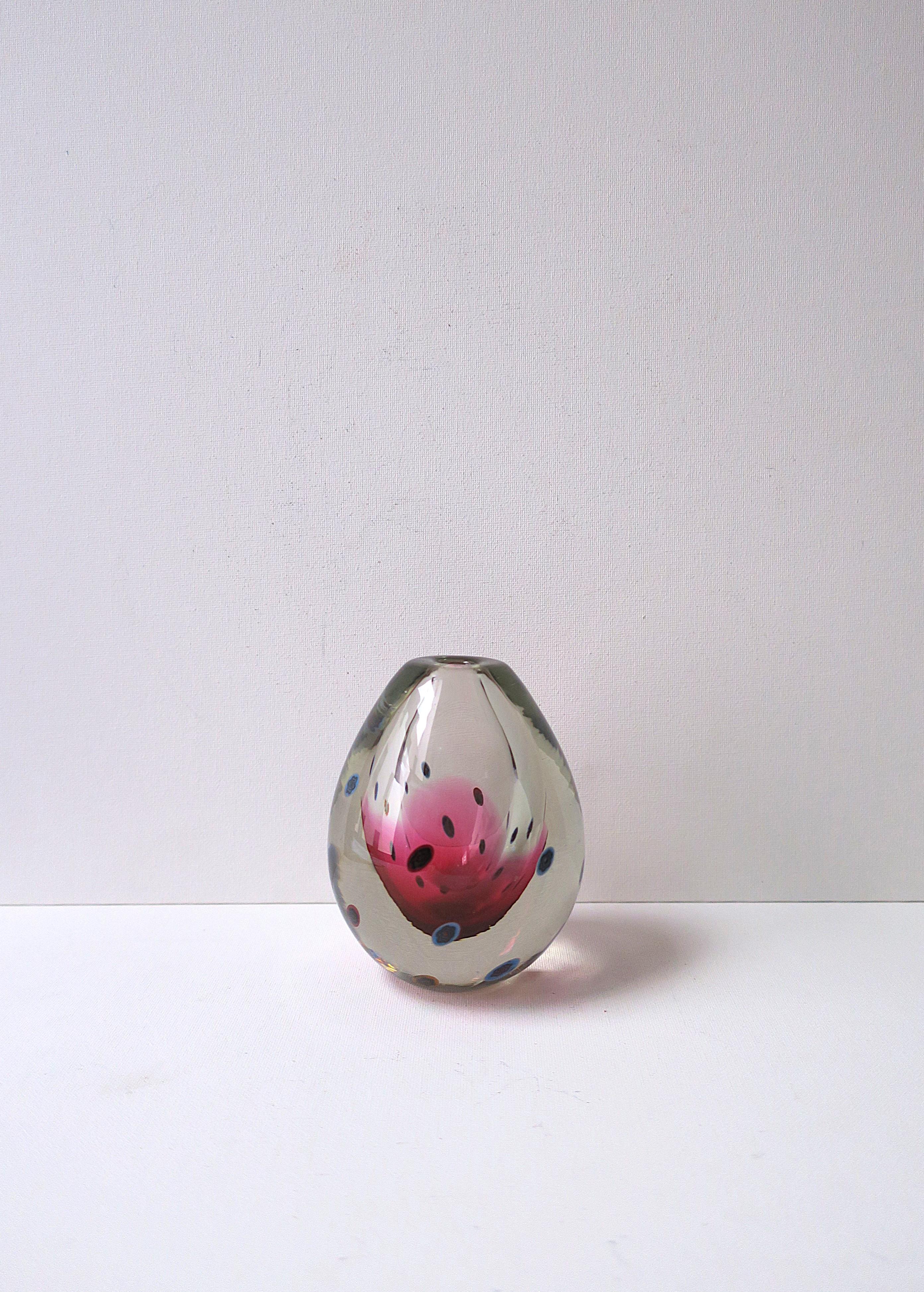 A very beautiful and substantial Italian Murano art glass vase with millefiori design, circa mid-20th century, Italy. Vase is clear transparent Murano art glass with a colorful millefiori design around exterior; inside a beautiful red raspberry hue