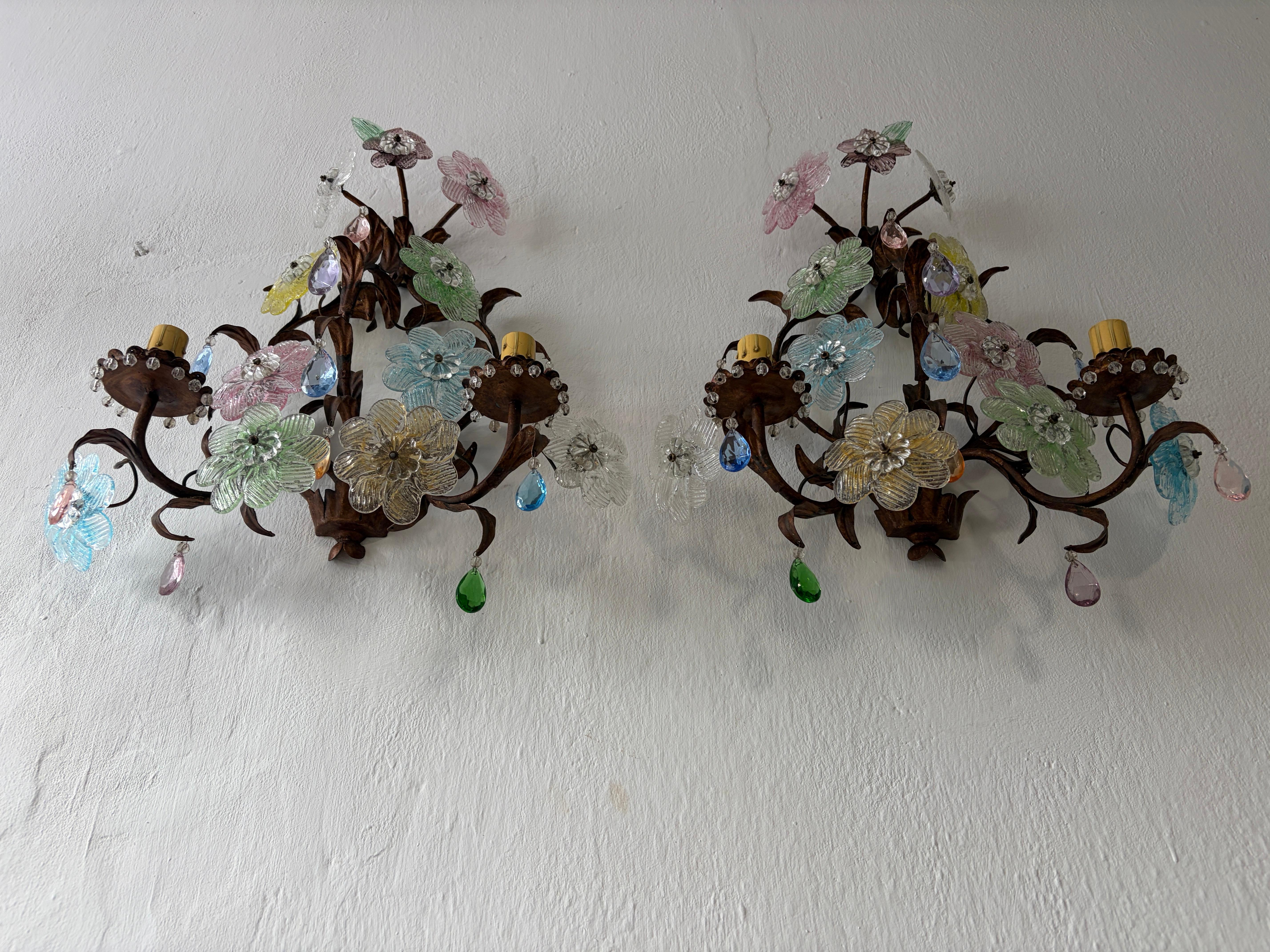Found these in a hotel, in the South of France that is in the middle of restoration.  The hotel had these (and a few chandeliers made custom for them). Very rare to find multi color Murano flower sconces.   Housing 2 lights each.  These will be