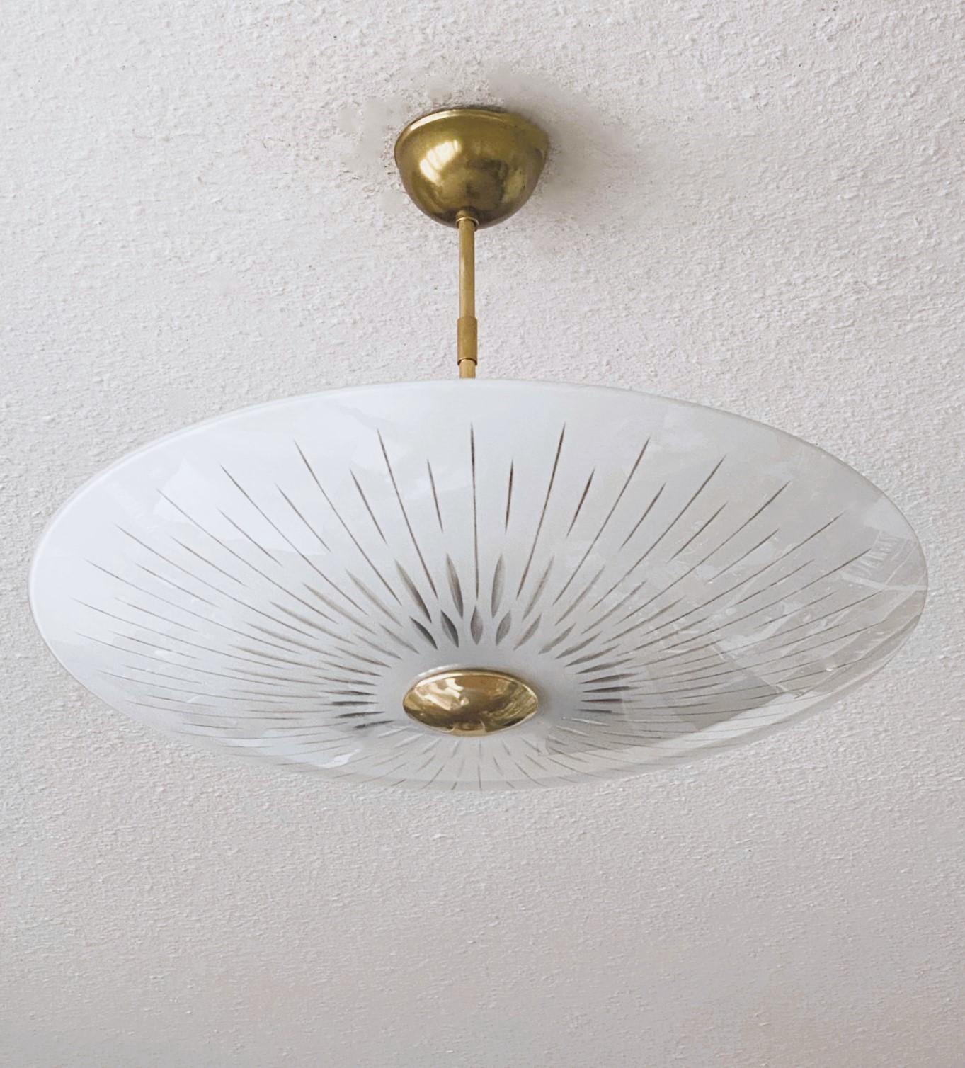 Fabulous Murano opalescent glass and brass three-light chandelier or flush mount designed and manufactured in Italy  in the 1950s, in the style of the renowned glass manufacturer Fontana Arte. Italian elegant design with a large curved white