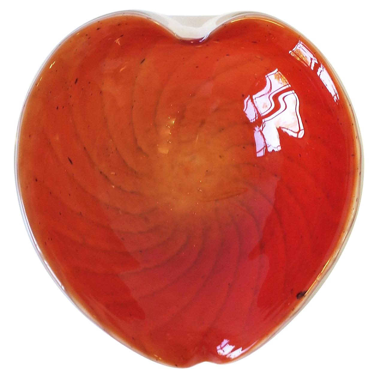 A beautiful vintage mid-20th century Italian Murano hand blown art glass bowl, Italy, circa 1960s. Bowl is white and orange art glass in a leaf form, an organic modern style. The white and orange glass is called 'incamicato'; a technique where two