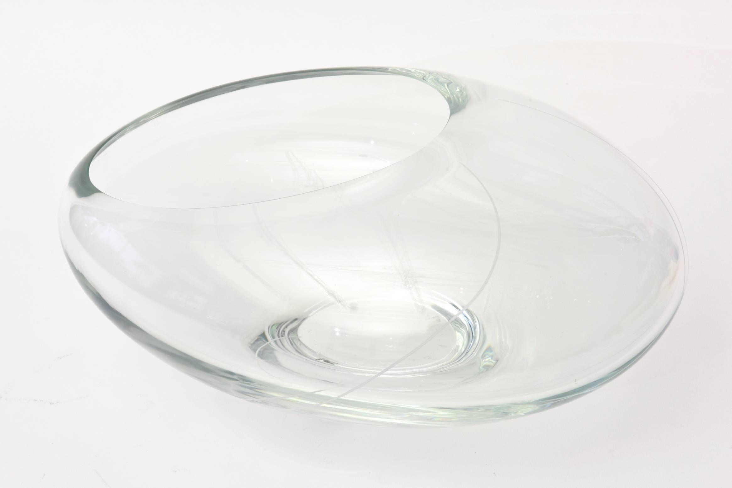 This stunning Italian Murano glass clear sculptural bowl / vase and or centerpiece by Seguso is asymmetrical. It has a plastic Murano Seguso label on it and is from the 1980s. There are a few white lines in a squiggly design on the clear glass. It