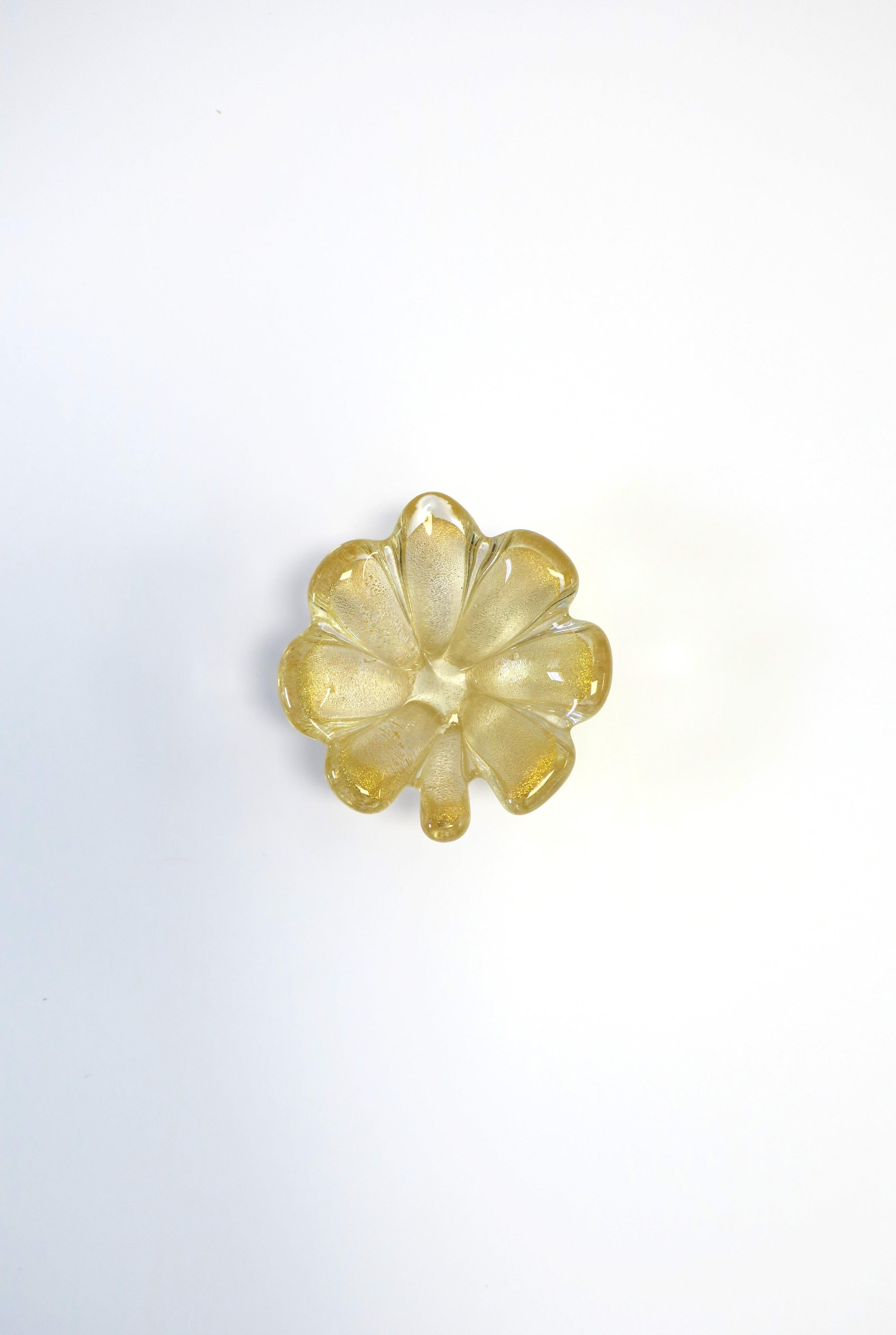 There are two (2) available. Each sold separately as per listing. 

A beautiful Italian Murano transparent/clear and shimmering gold art glass 'flower' jewelry dish in the Organic Modern style, circa late-20th century, Italy. A beautiful small