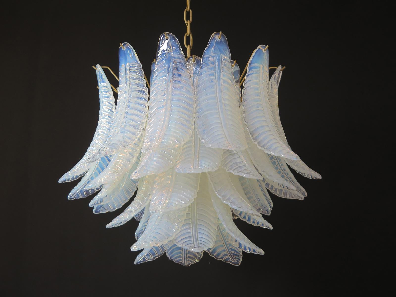 Beautiful Italian Murano chandelier composed of 36 splendid opaline glasses that give a very elegant look. The originality of this chandelier is given by the glass, wonderful works of art in opal glass, with transparent blue reflections. Murano