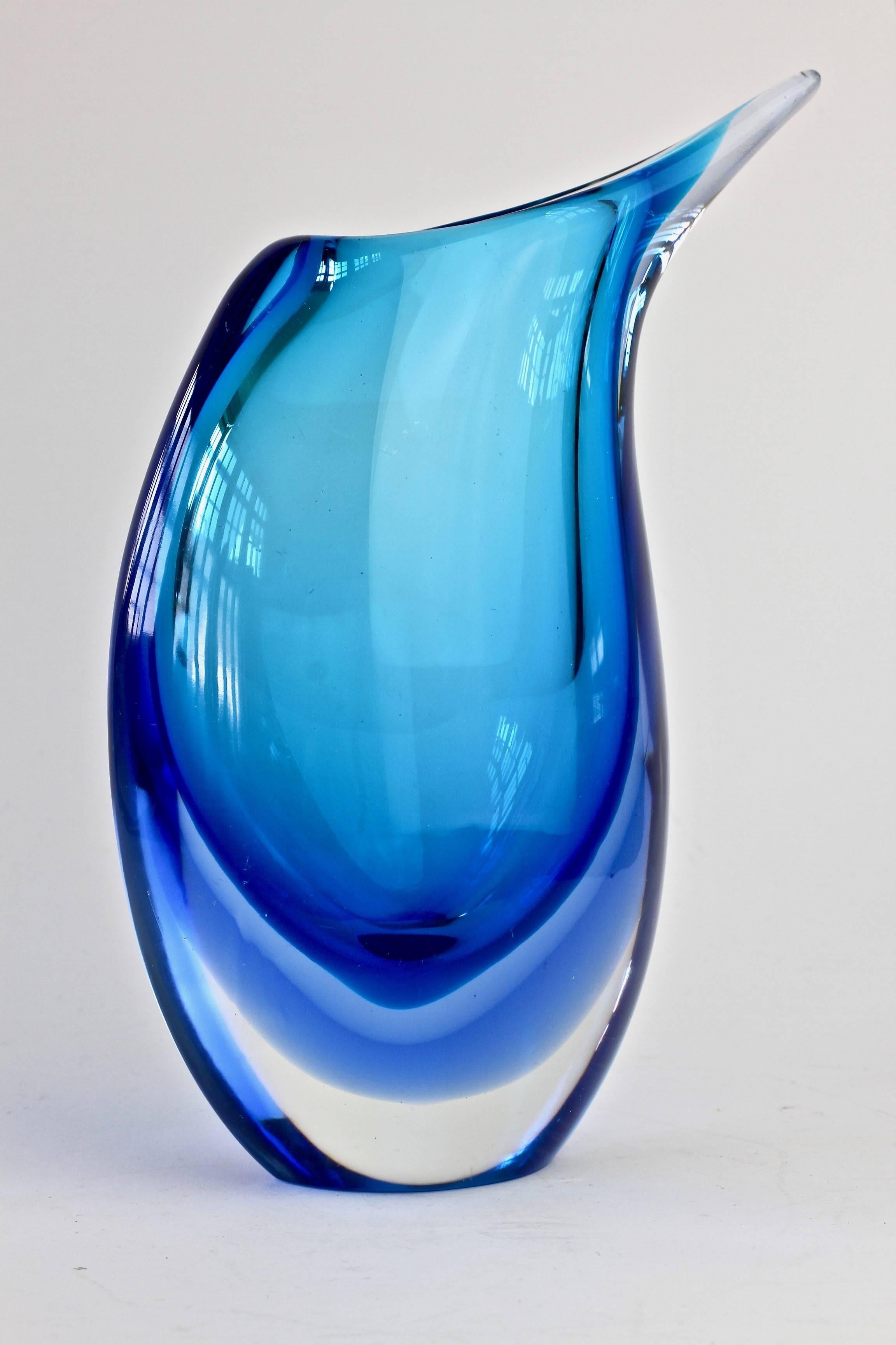 A beautiful midcentury Murano art glass vase attributed to Flavio Poli for Seguso Vetri d'Arte, circa 1960s. Beautiful color (colour) combination of clear glass over a spectrum of blues. The 'Sommerso' glass looks simply stunning when it captures