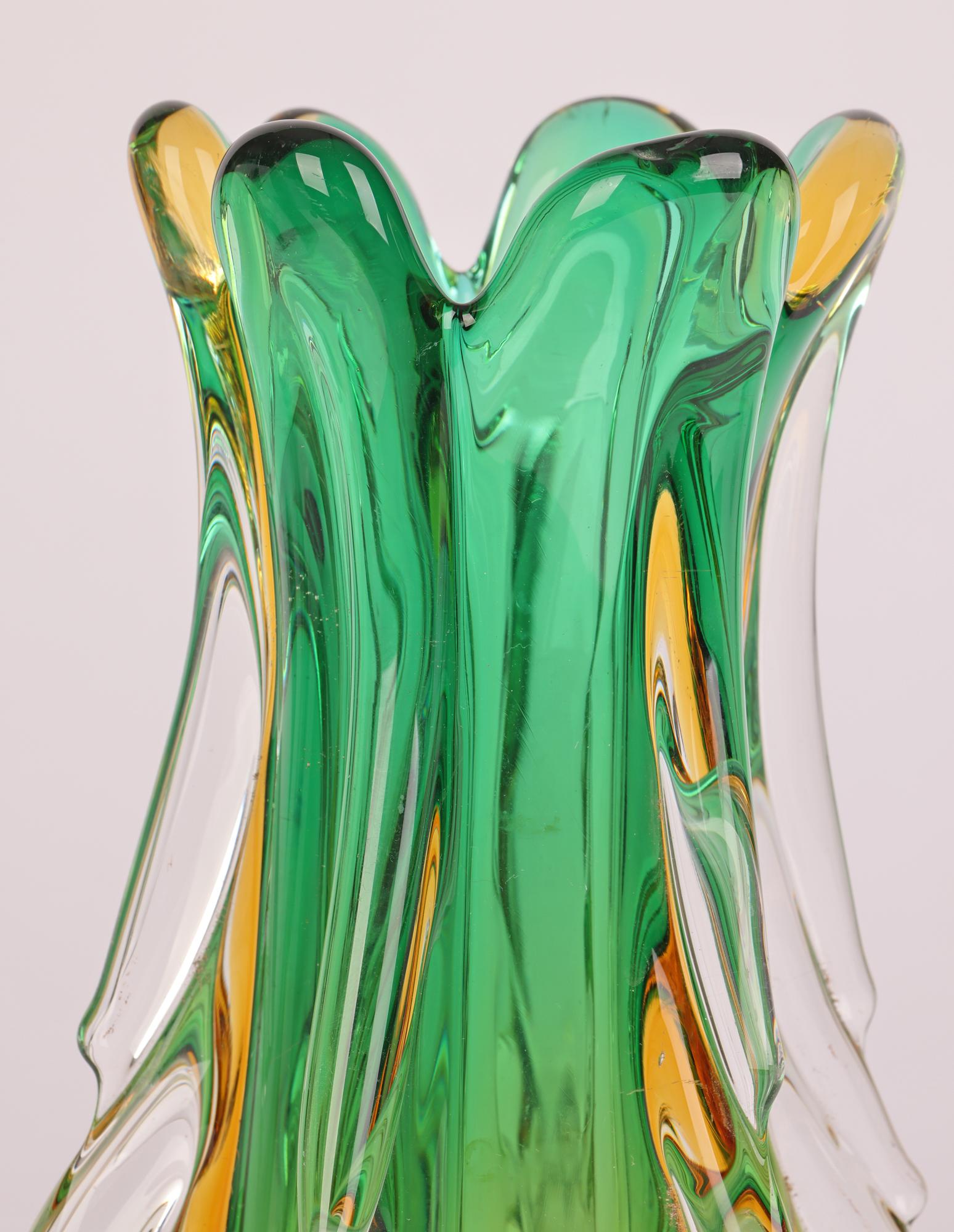 A stunning and rare mid-century Italian Murano sommerso art glass vase attributed to renowned Italian artist Flavio Poli (Italian, 1900-1984) and made for Seguso Vetri D’Arte and dating from around 1960. The vase hand blown in clear glass is heavily