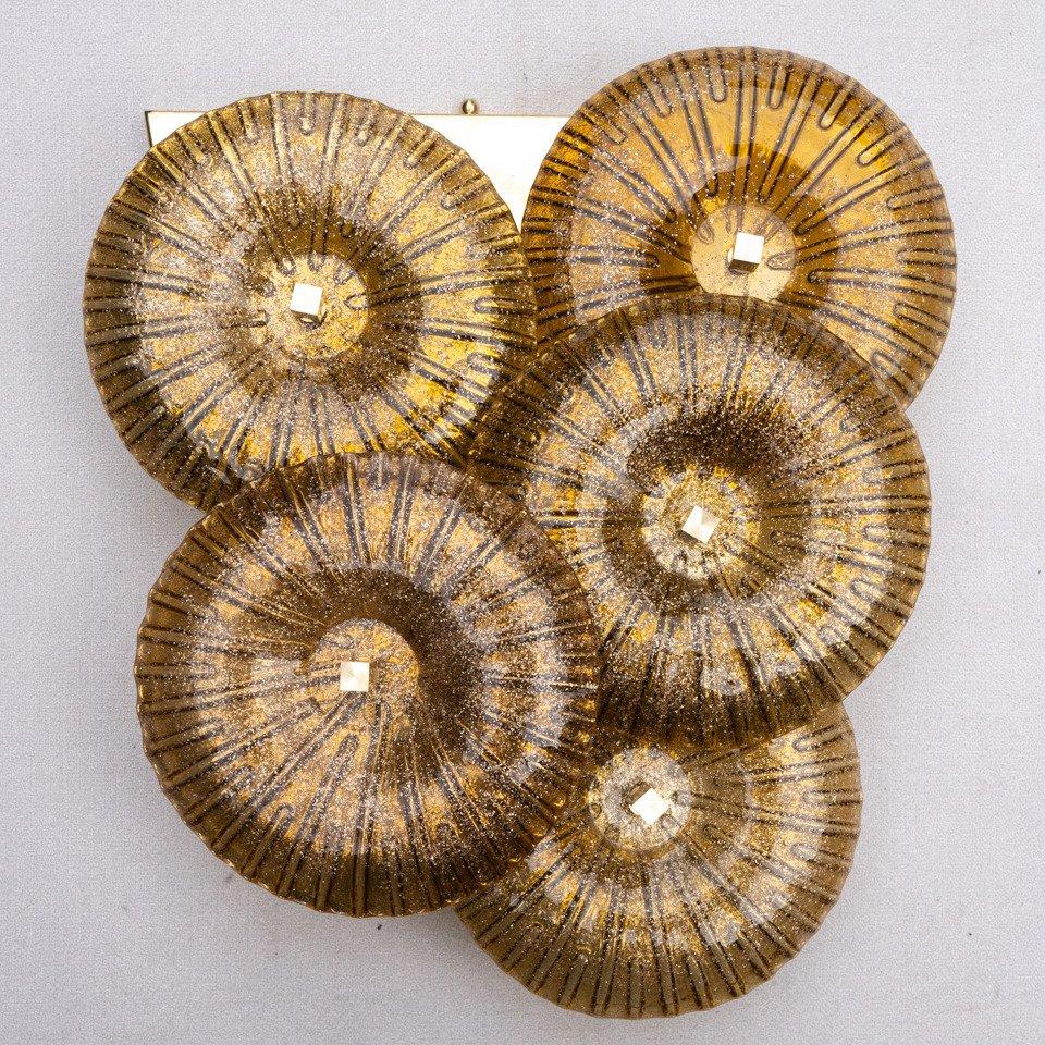 Italian Murano Wall Sconces made by eModerno, meticulously created in Italy to meet the highest standards of quality.
Five gold glass discs sit attached to a brass back plate wired to Australian standards.
Each sconce is unique and there are slight
