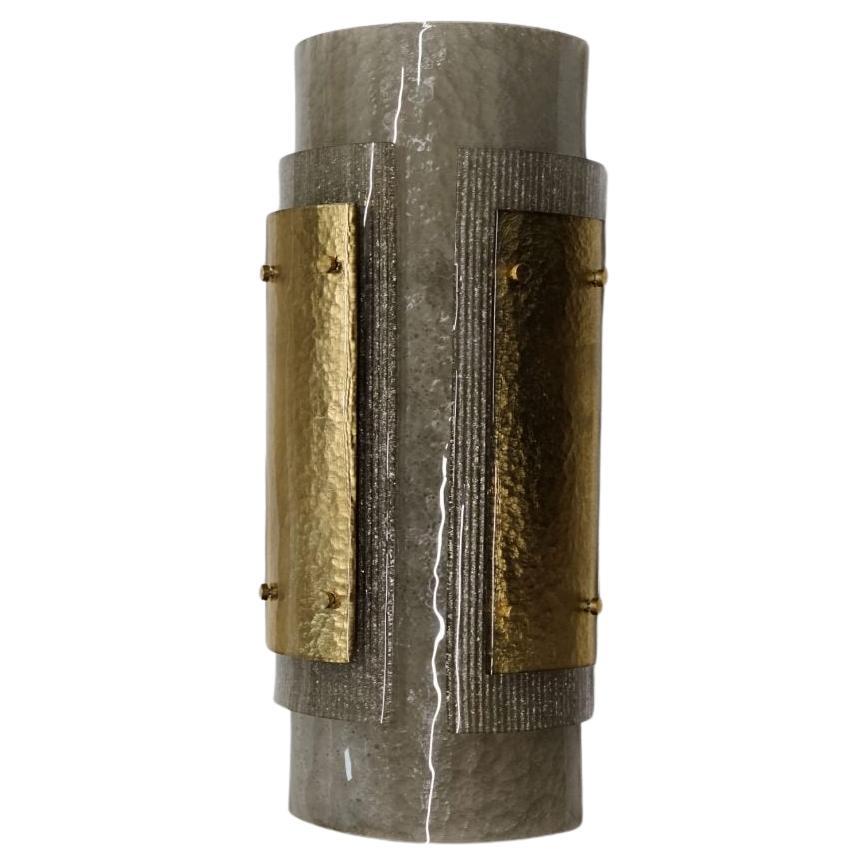 Italian Murano Wall Sconces made by eModerno, meticulously created in Italy to meet the highest standards of quality.
Three types of textural Murano glass make up this large sconce. A smoke coloured semi-circular form with rectangular silver and