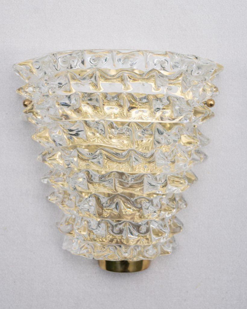 Italian Murano Wall Sconces made by eModerno, meticulously created in Italy to meet the highest standards of quality.
These beautiful v-shaped Rostrato sconces sit on brass back plate.
Made by hand in Venice, each sconce is unique and there are