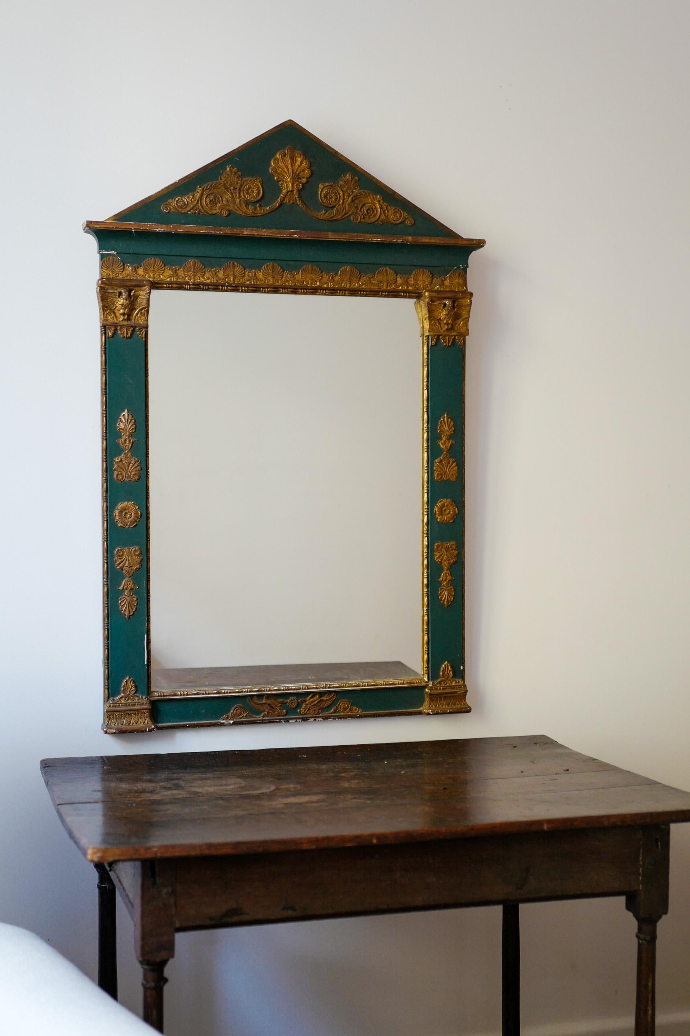 Napoleon mirror Italian 1800's Palladian top carved and gilded with shell and acanthus leaf scrolls and painted green and decorated with gold friezes.