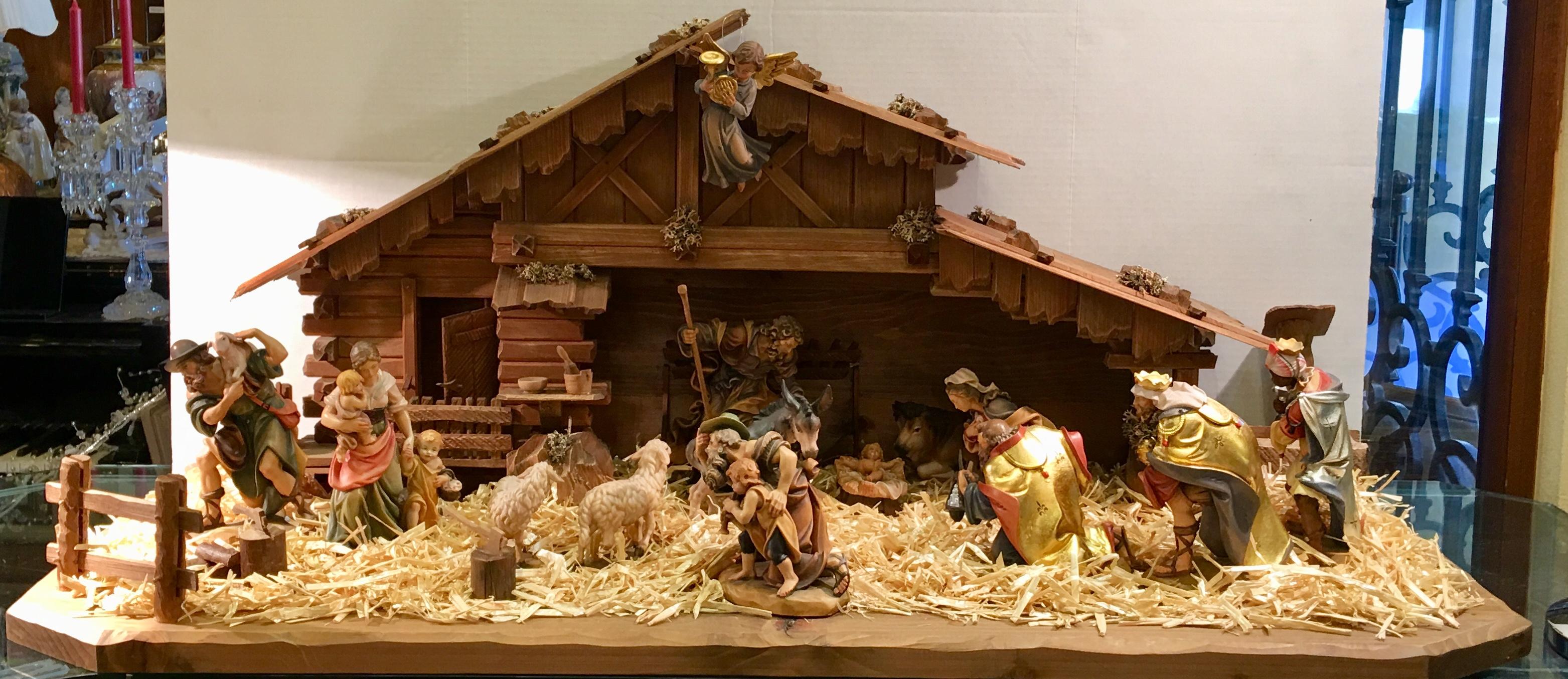 Magnificent, elaborately handmade and hand carved, hand painted, very large linden wood nativity scene from the Dementz Family DEUR Art Company in South Tyrol, Italy, is a museum quality Christmas decorating focal point. An heirloom to pass down