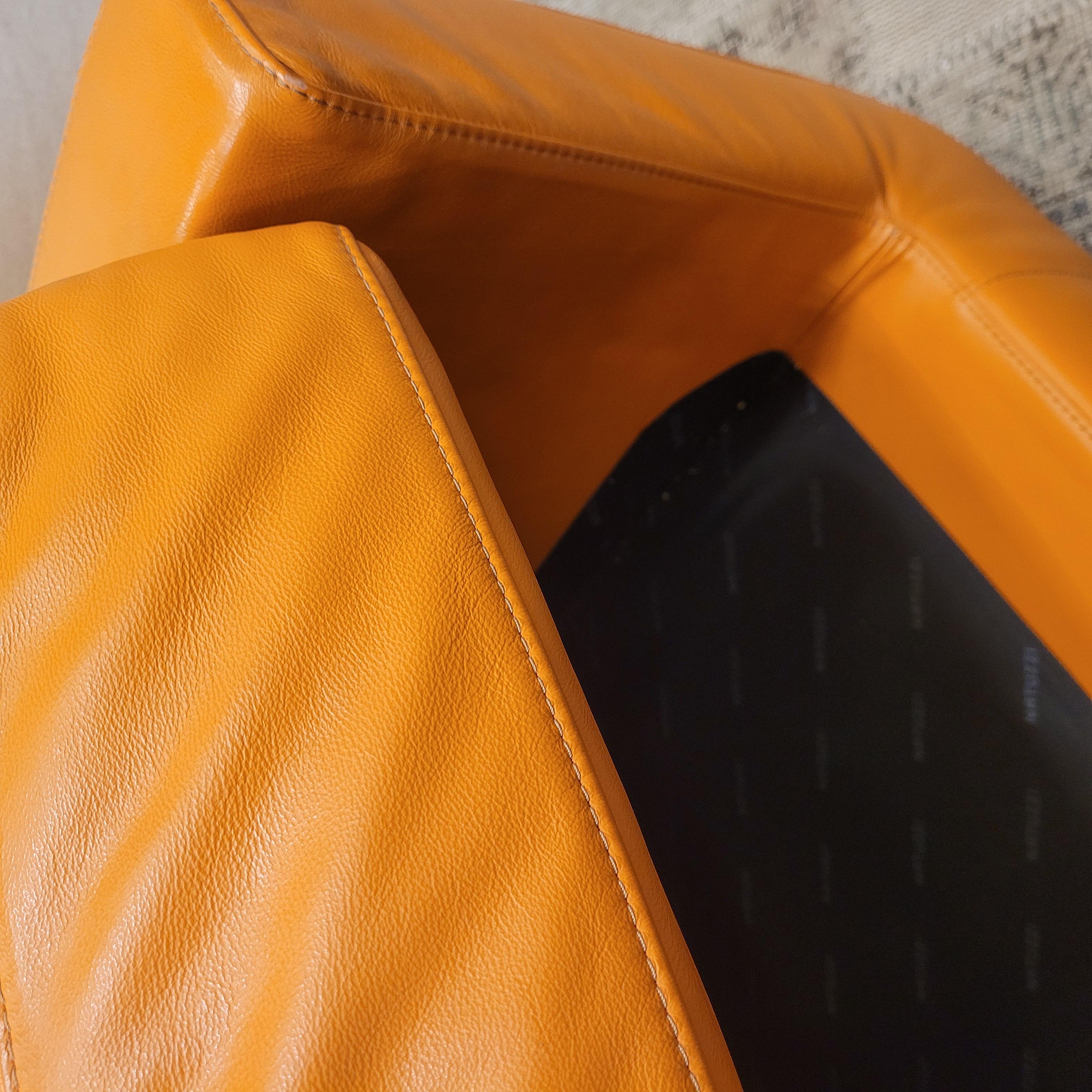 Italian Natuzzi Orange “Suad” swivel armchair, orange leather For Sale 9