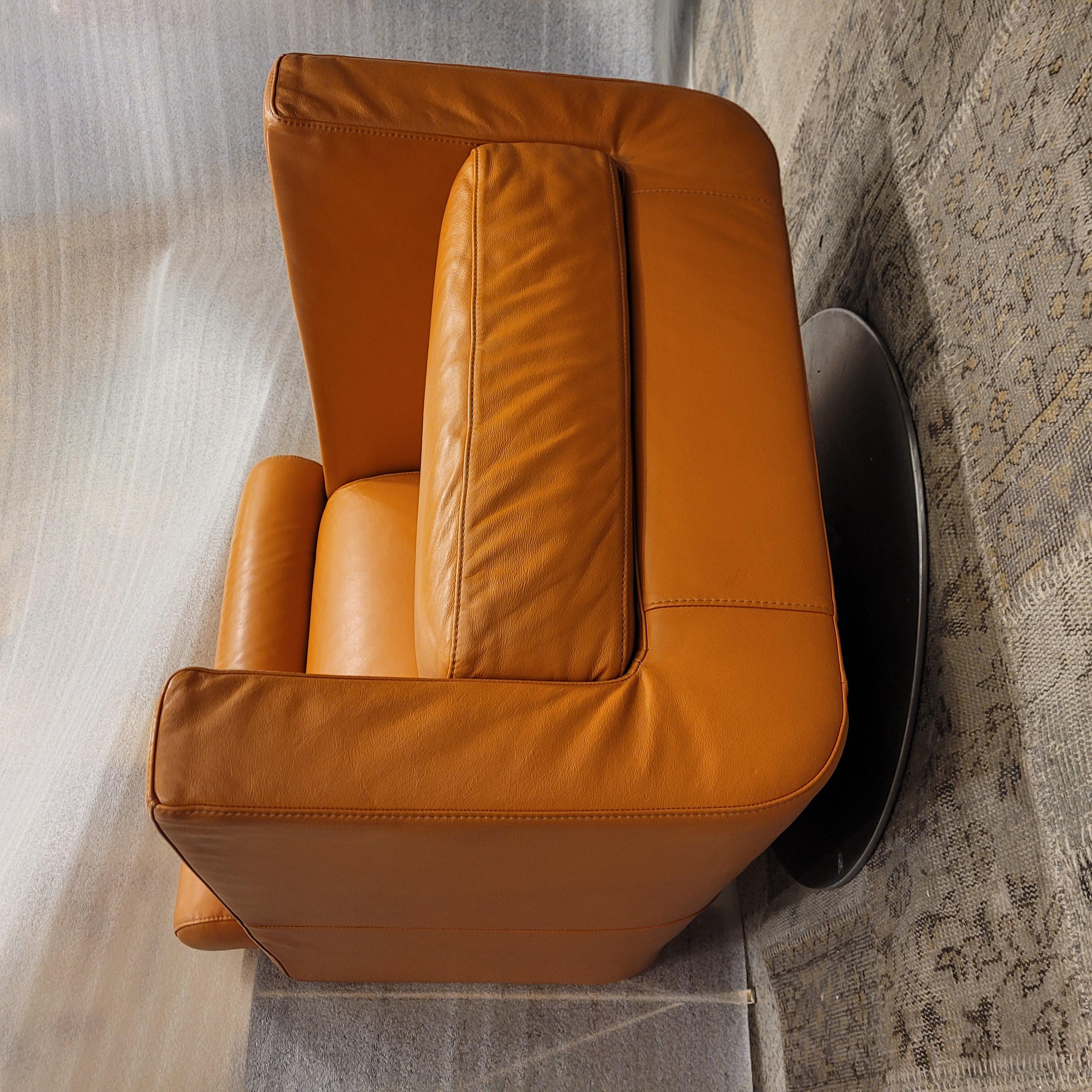 Hand-Crafted Italian Natuzzi Orange “Suad” swivel armchair, orange leather For Sale