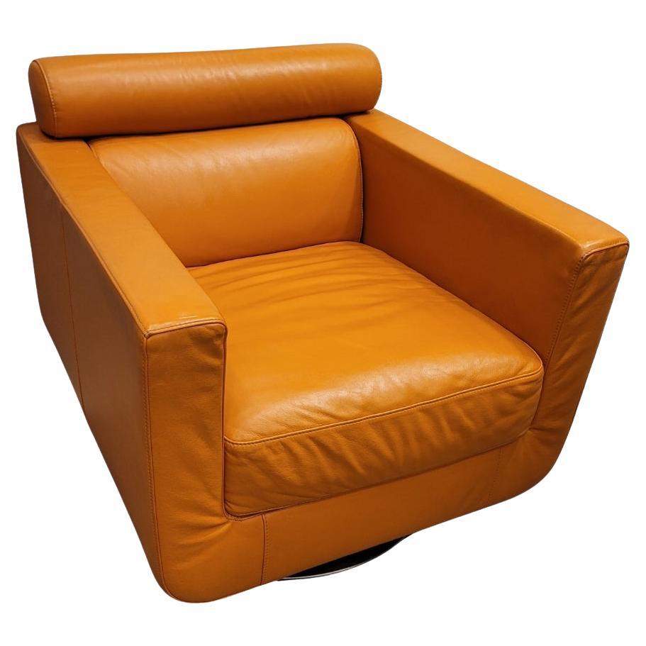 Italian Natuzzi Orange “Suad” swivel armchair, orange leather