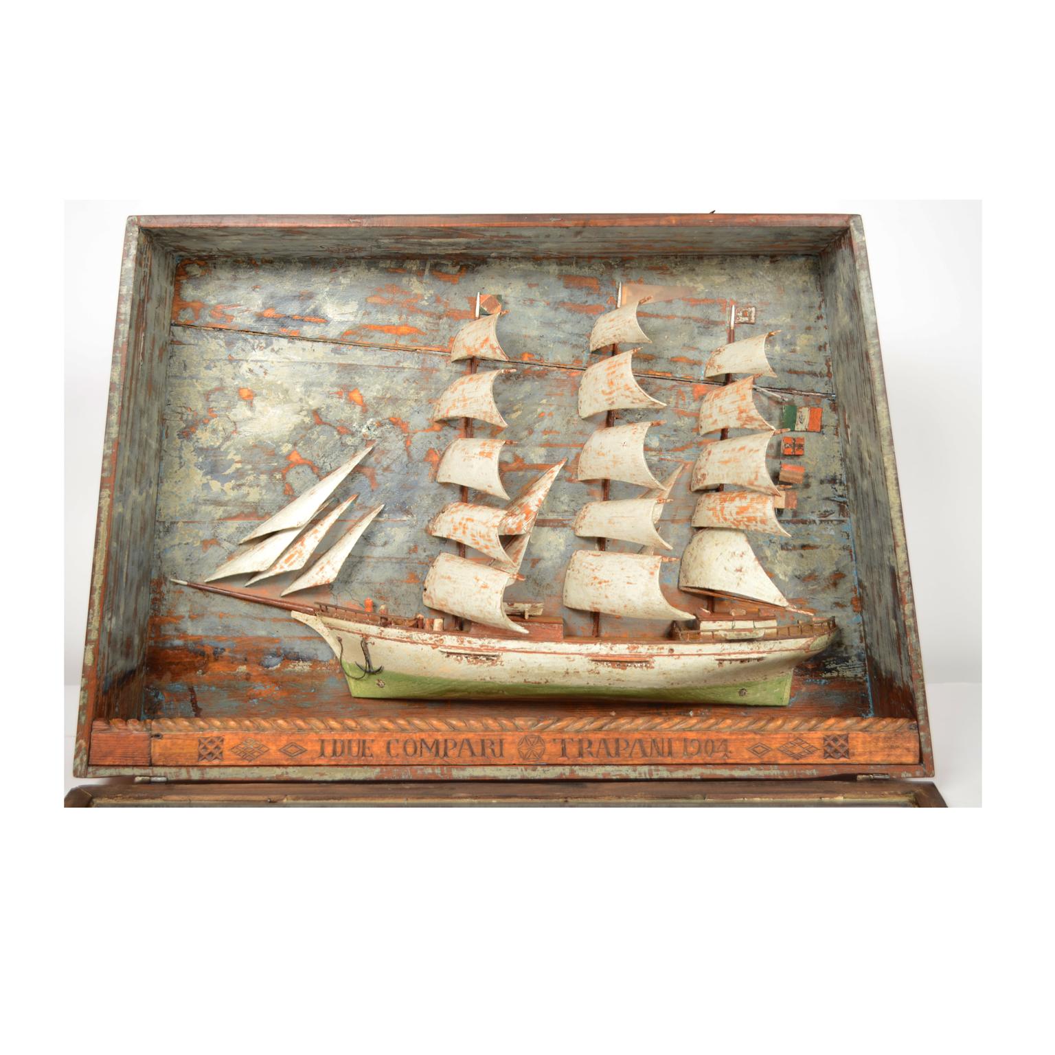 Nautical diorama depicting half hull of a 3-mast sailing ship, with full sail made of wood, 