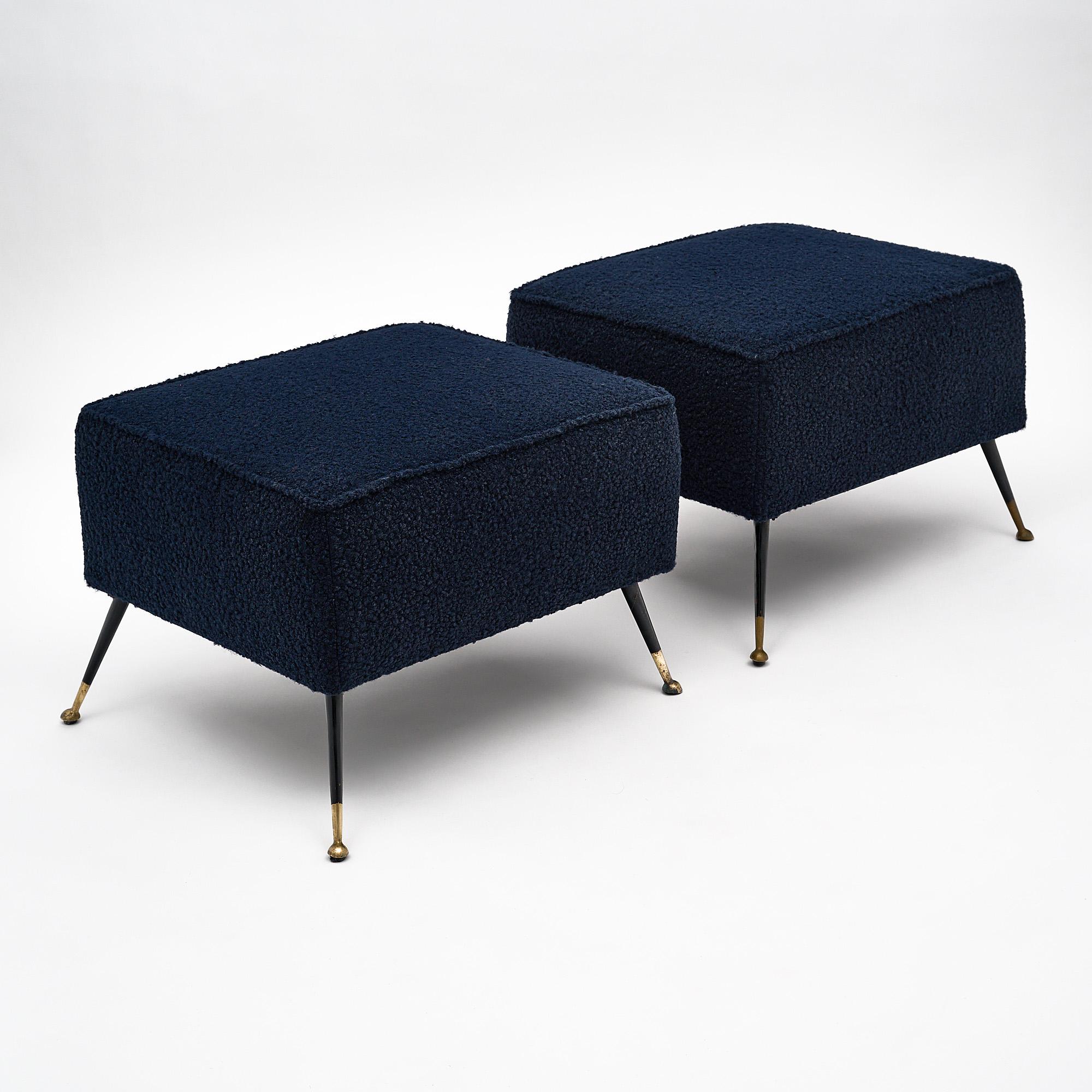 Pair of Italian rectangular stools with black lacquered steel and brass legs. They have been newly upholstered in a navy blue wool blend.