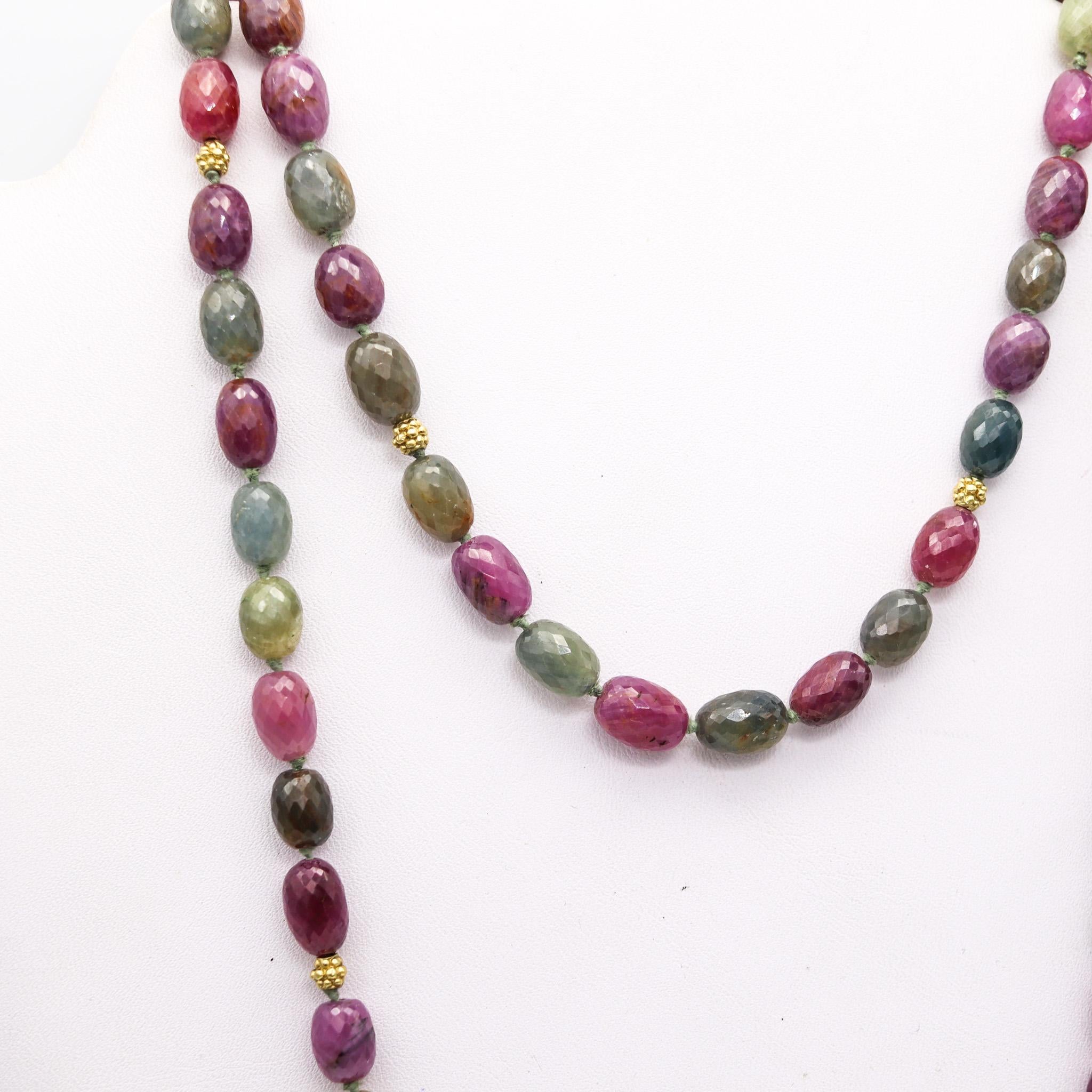 A long necklace sautoir with color sapphires.

A versatile long necklace sautoir, crafted in Italy with 18 karats yellow gold stations and seventy-nice carved natural sapphires of diverse colors such; pink, green, light blue and purple. Fitted with
