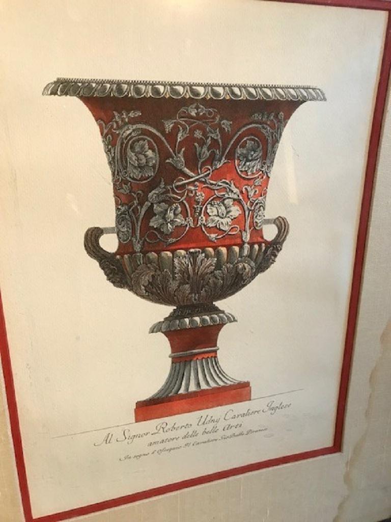 Pair of Italian neo-classic architectural engraving in a red frame of a red ornate classical urn (19th Cent) (some water damage to matting).
 