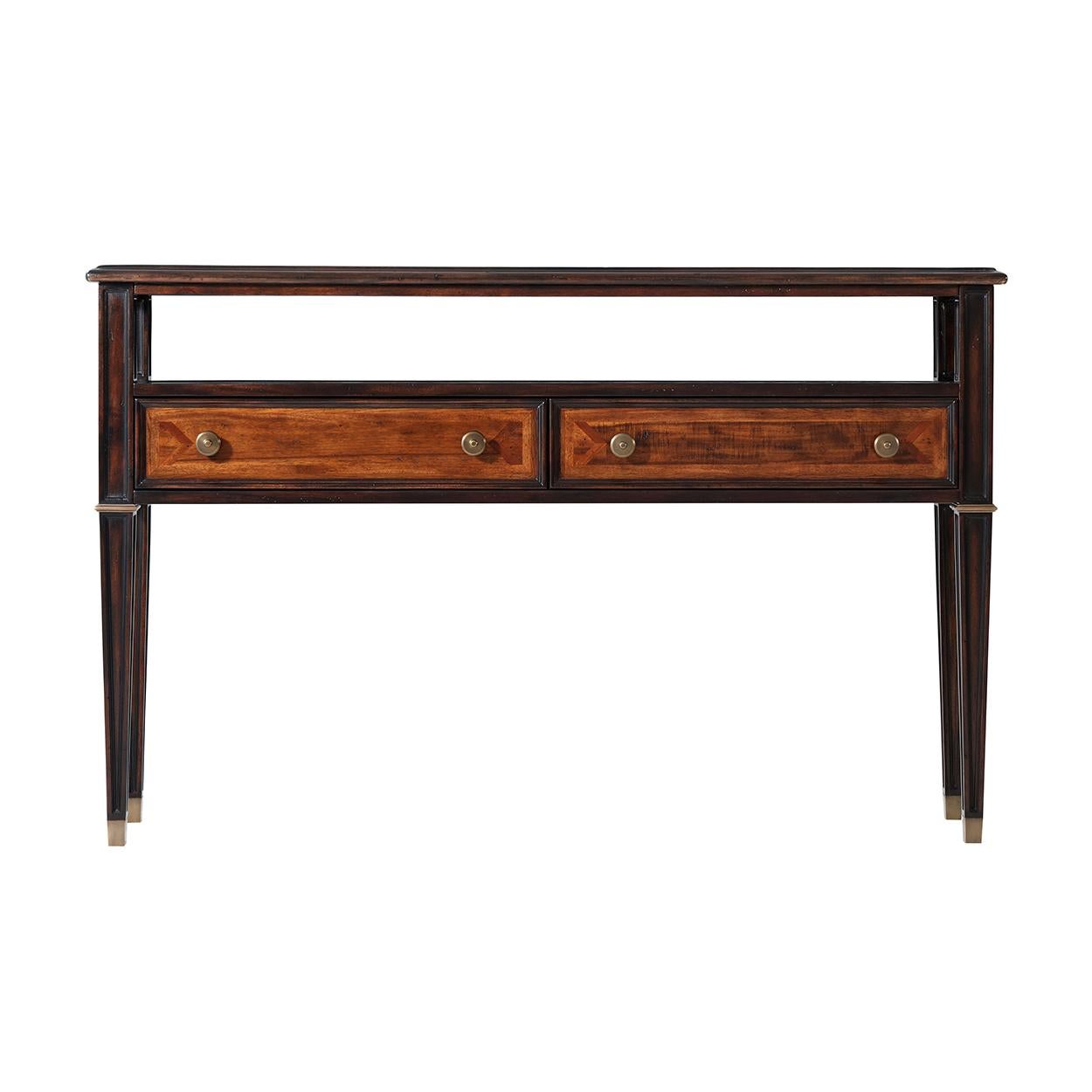 An Italian neoclassic parquetry console table, the rectangular moulded edge and glass inset top above an open shelf two drawers below, on square tapering legs with brass cappings. Inspired by a 19th century Italian original.

Dimensions: 54