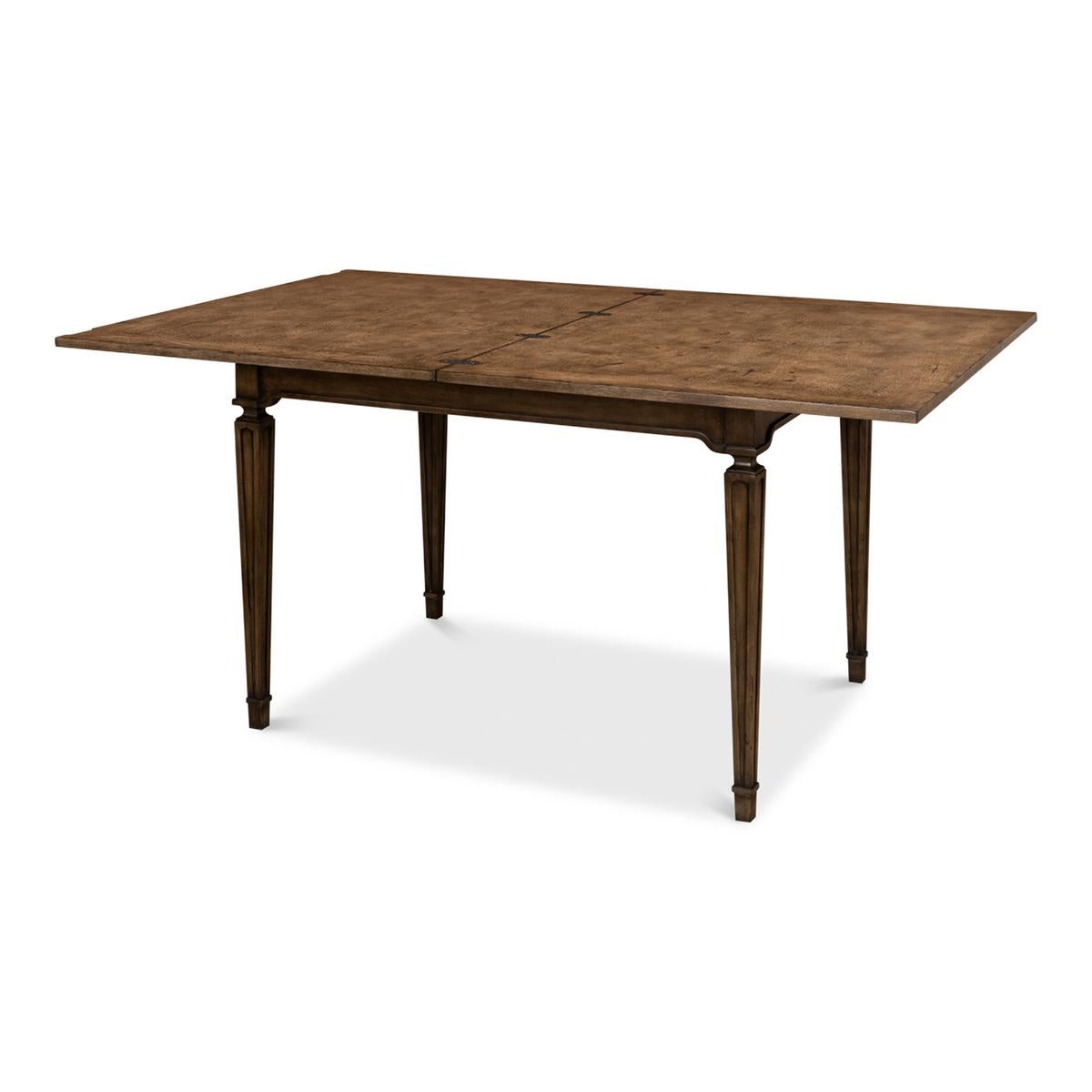 An Italian Neo-Classic style walnut game table or dining room table. This unique table folds open and extends from 42
