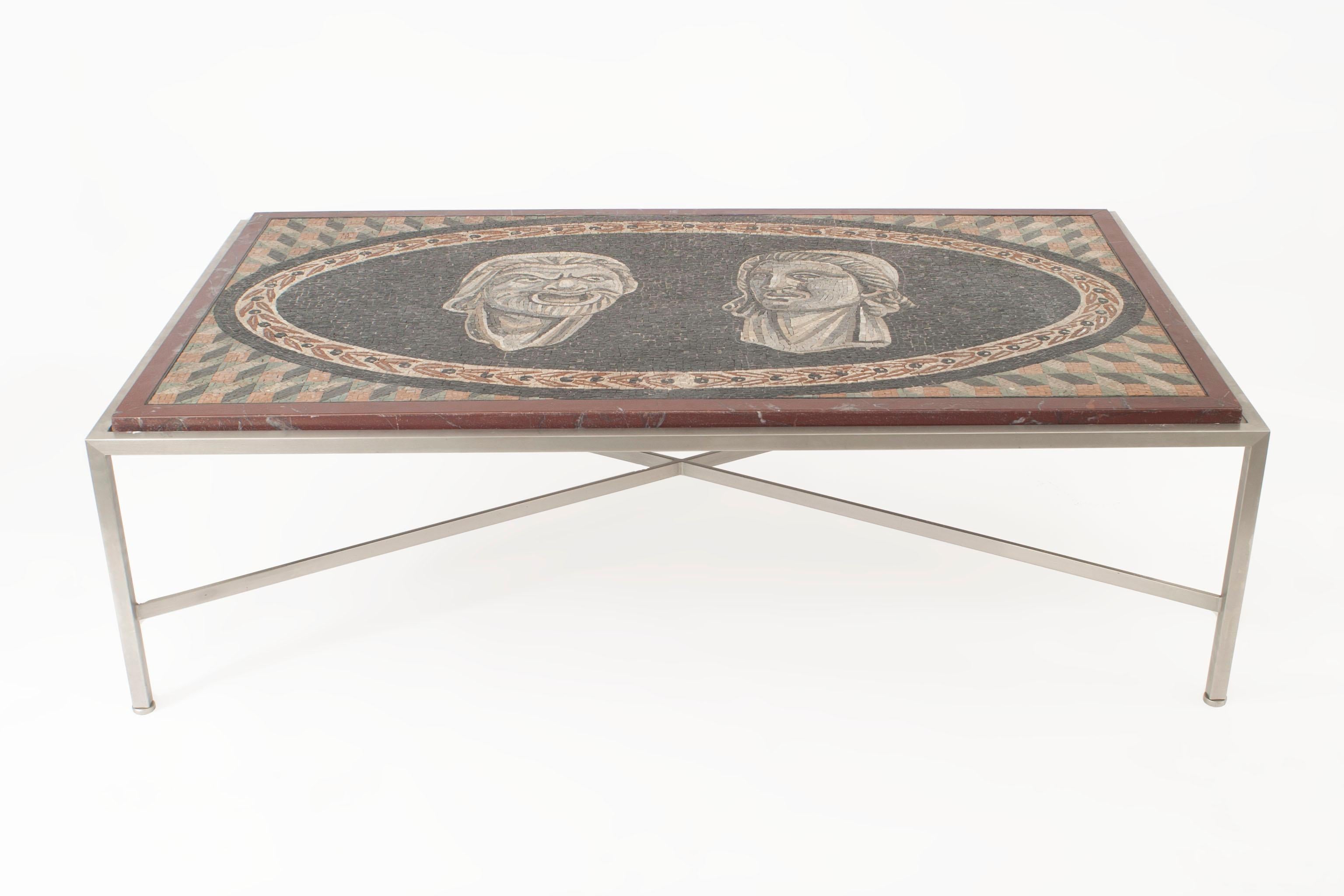 Italian Neo-Classic rectangular coffee table with mosaic marble top (19th Century) showing 2 Roman faces set in a steel base with a stretcher.