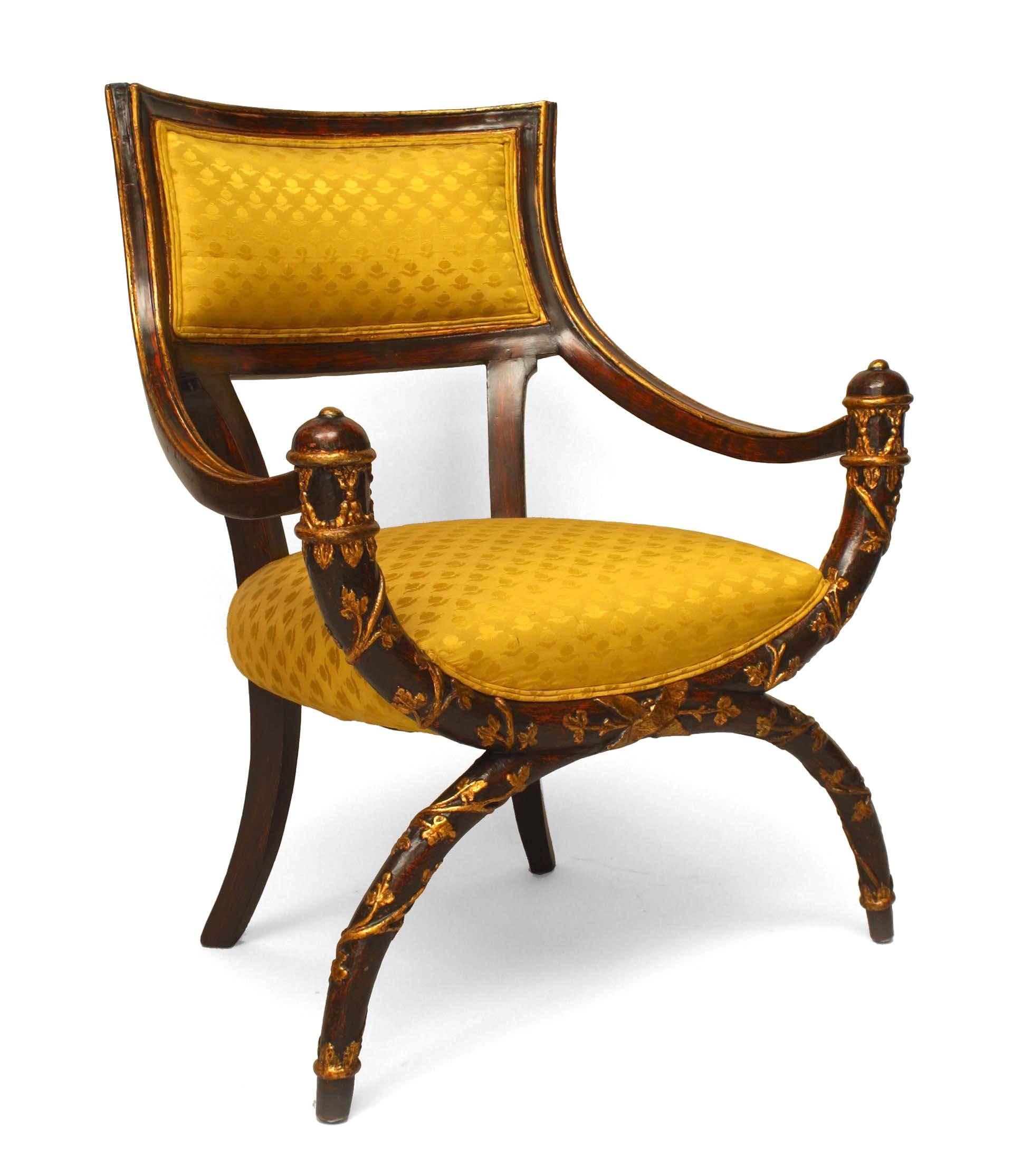 Italian Neoclassic-style (19th Century) X design maroon lacquered armchair with gilt floral trim and gold damask upholstery.

