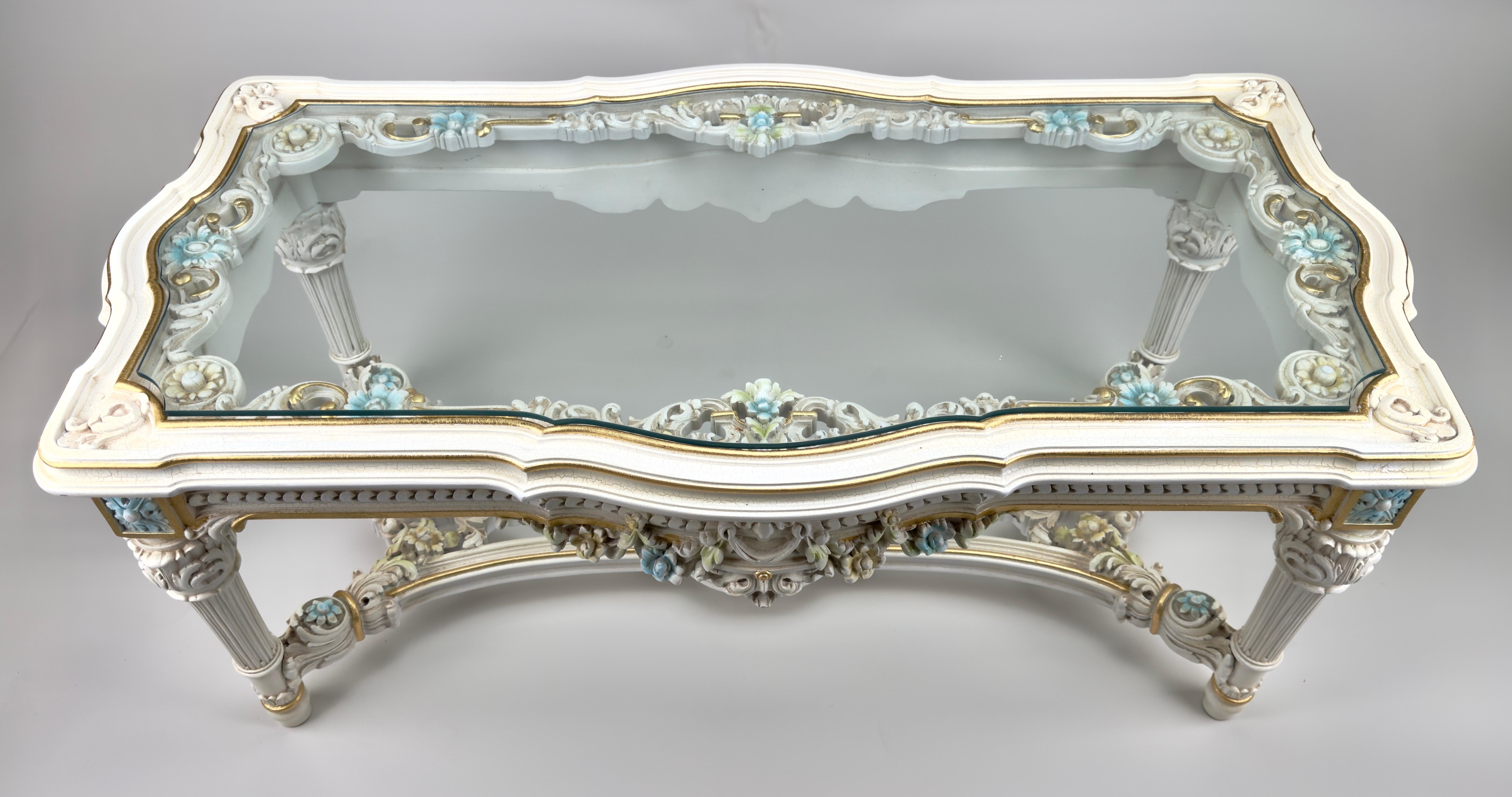 An Italian Neo-Classical Baroque style coffee or cocktail table—an exquisite fusion of opulence and artistry. Crafted with meticulous attention to detail, 
the table's surface is adorned with finely carved floral patterns, each intricately detailed
