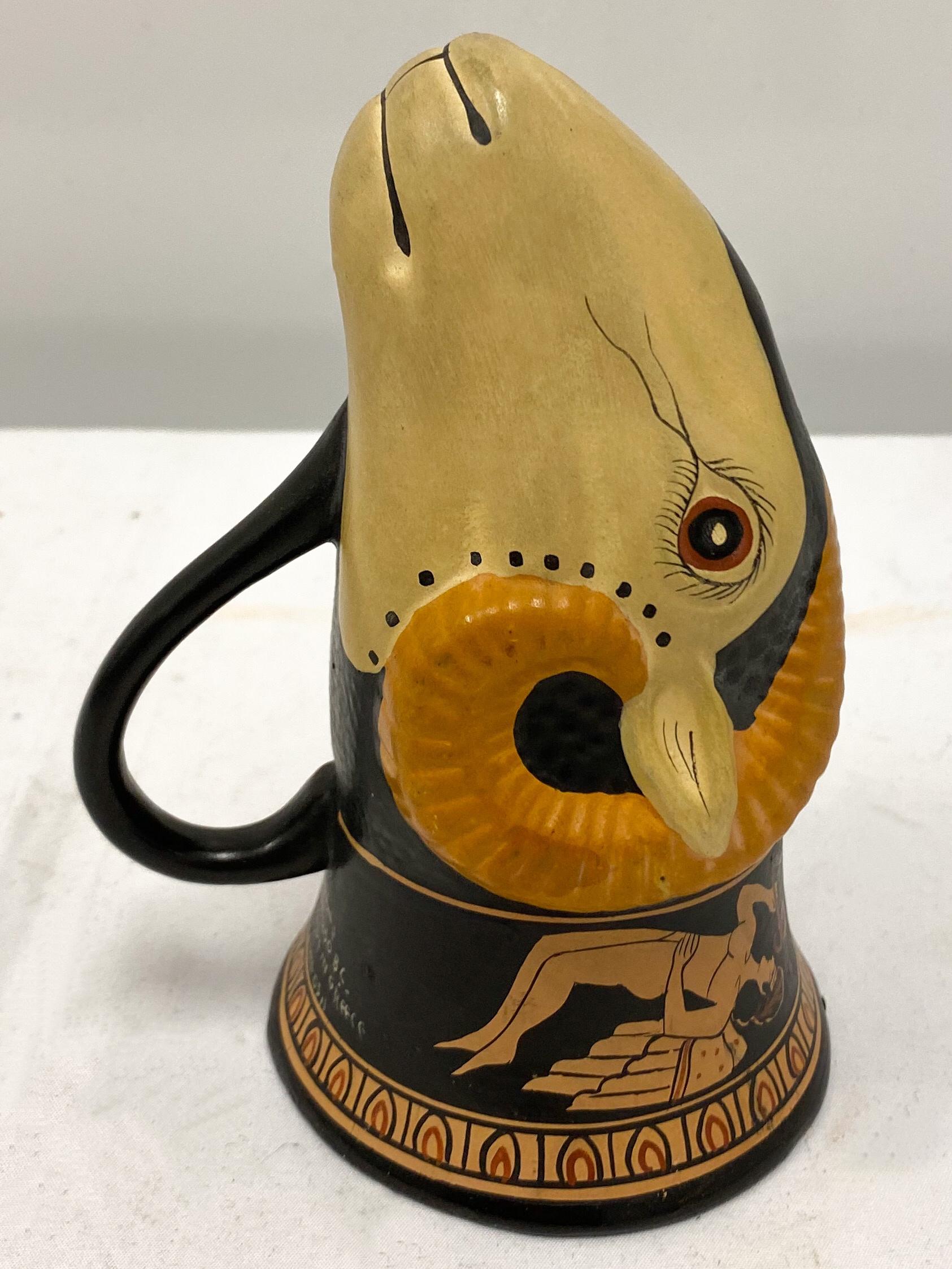 This is an Italian neo-classical Grand Tour ram’s head form stirrup cup. The composition is pottery with an almost bisque-like finish.