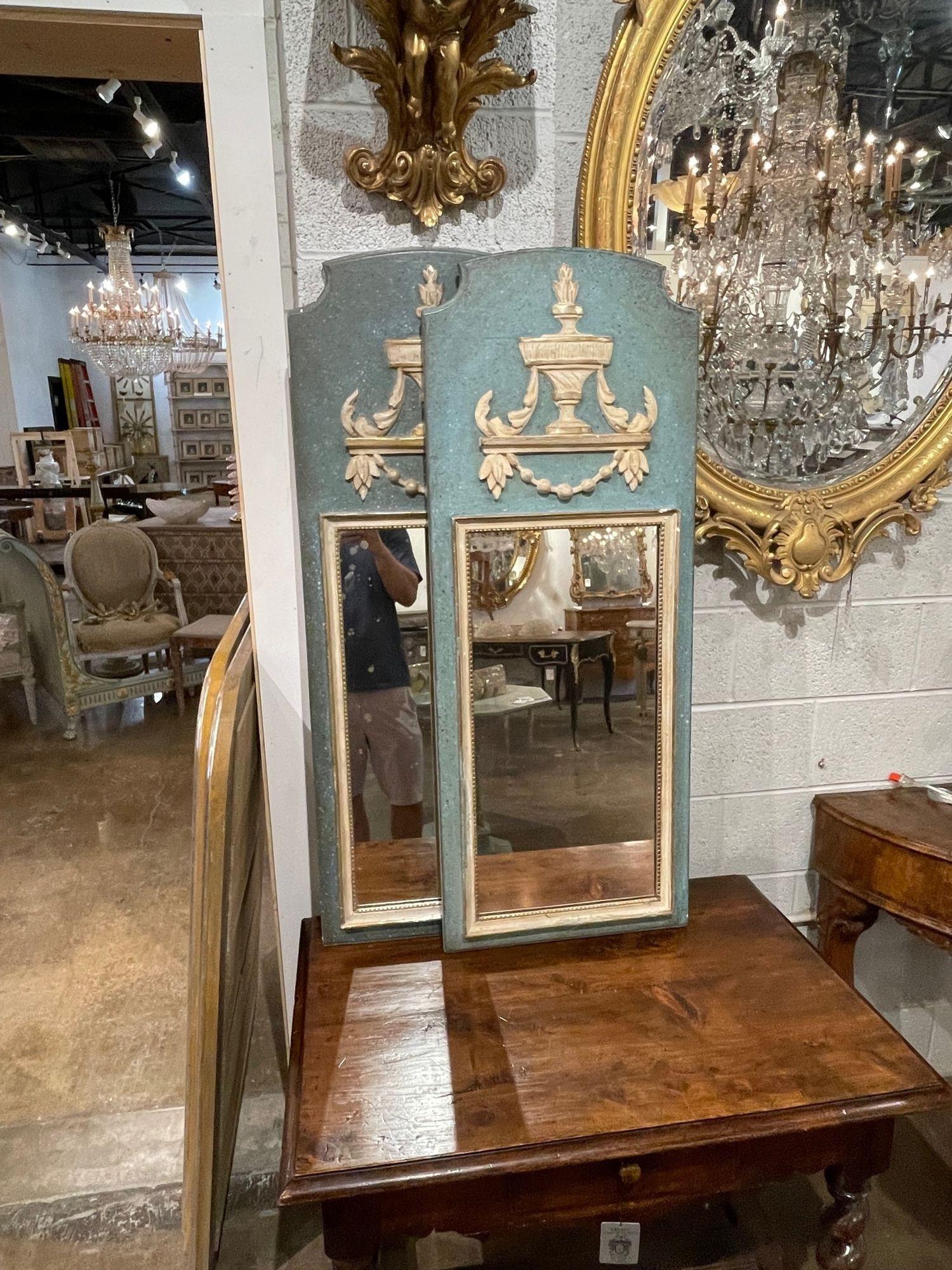 Decorative vintage Italian Neo-Classical carved and painted mirrors. Very pretty patina along with a beautiful urn at the top and a beaded inner border. Lovely!