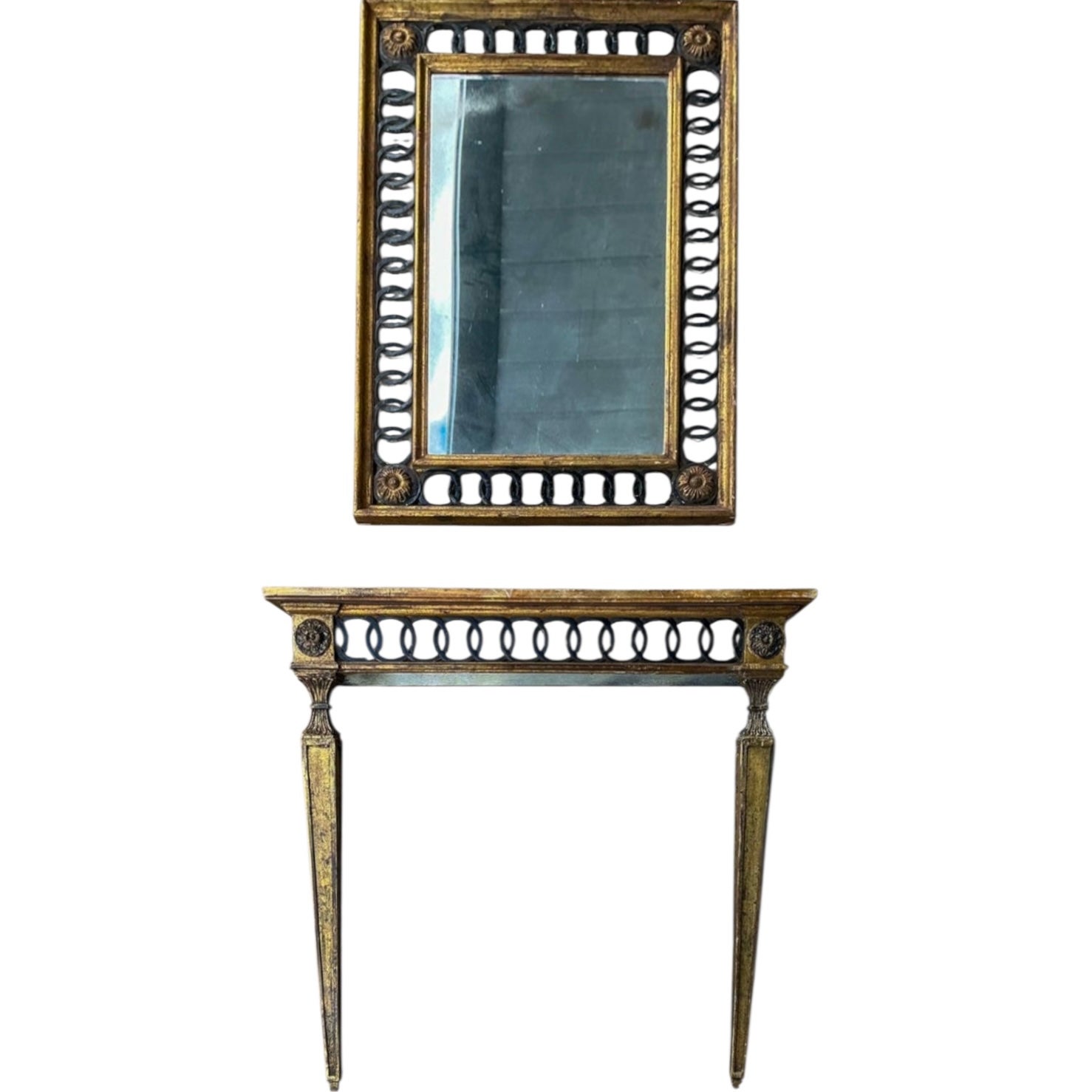 This is a killer set! This is an Italian neo-classical style console table with coordinating mirror attributed to Palladio. The console is wall mounted, and it has a faux marble top. The ebonized concentric circles add elegance to the set. Both