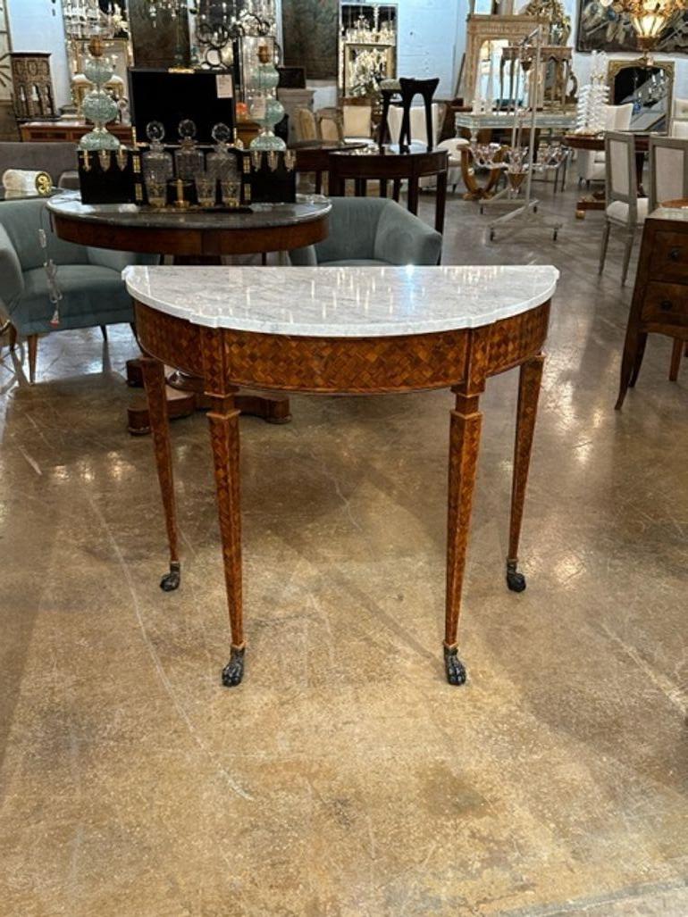 Handsome Italian neo-classical parquetry walnut demi-lune console with carrara marble top. circa 1920. Adds warmth and charm to any room!