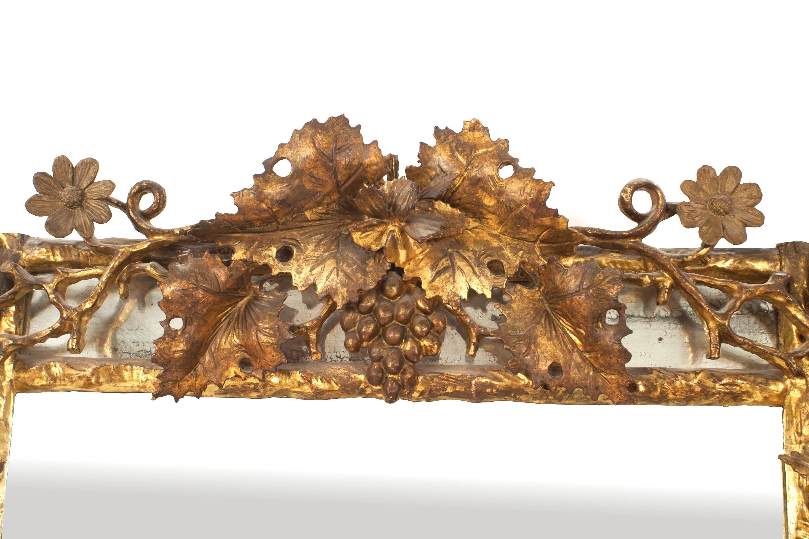 Italian neoclassic (18th-19th century) gilt rectangular wall mirror with a rustic filigree floral design frame.
     