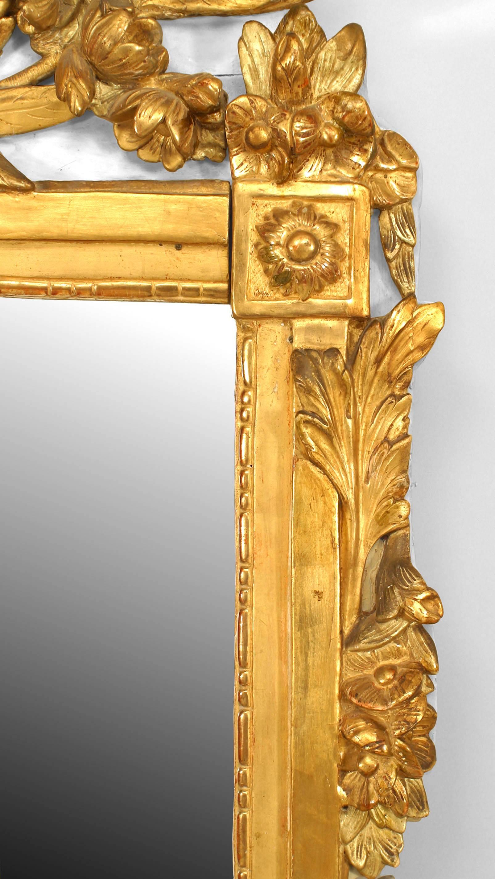 Italian Neoclassic (18th Century) carved giltwood and cream painted wall mirror with carved leaves and urn pediment top.
