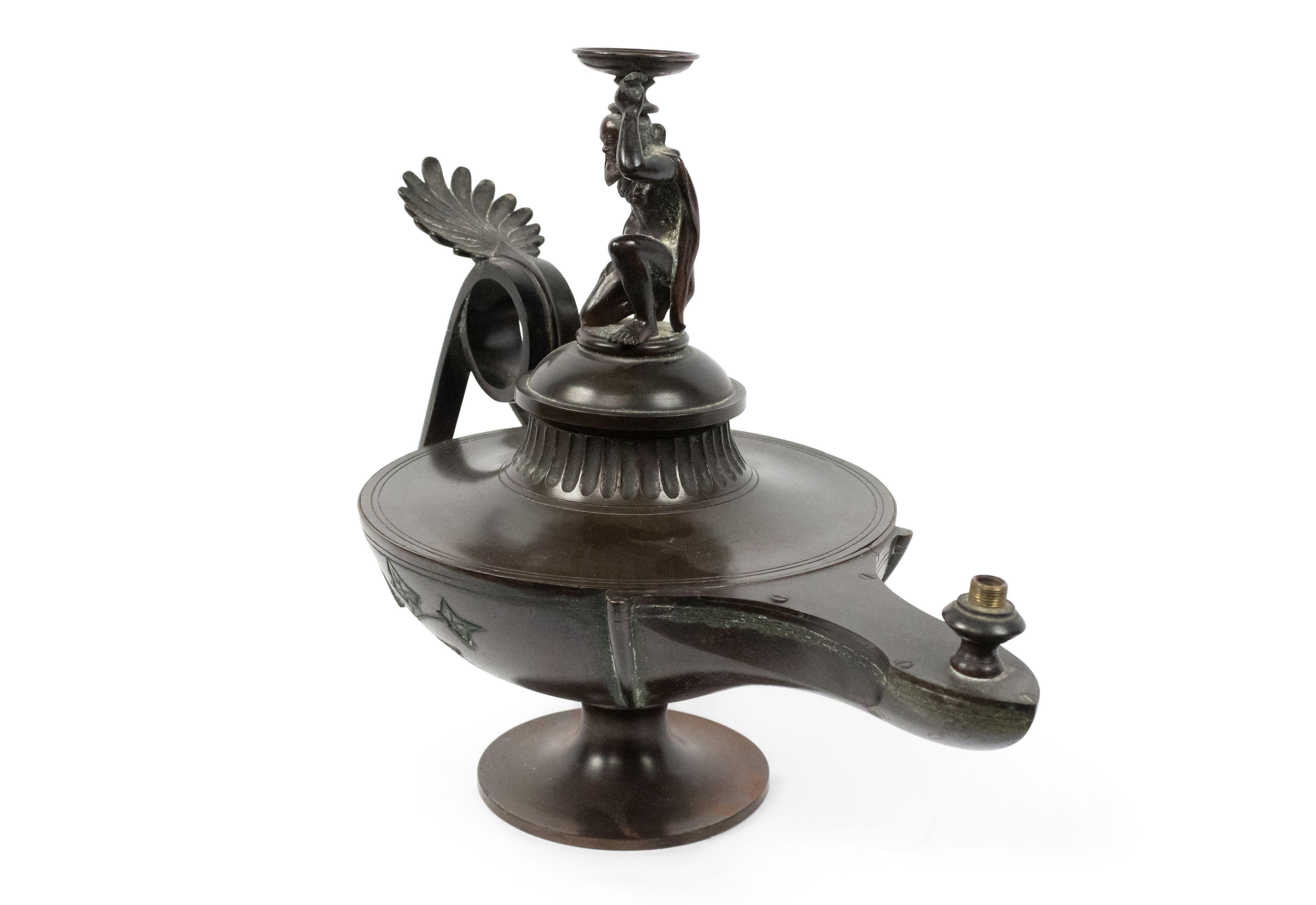 Pair of Italian neoclassic style (19th century) bronze Aladdin lamps with figural top.